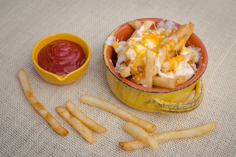 Order French Fries with Cheese - Medium food online from La Casa De Pizzeria store, Troy on bringmethat.com