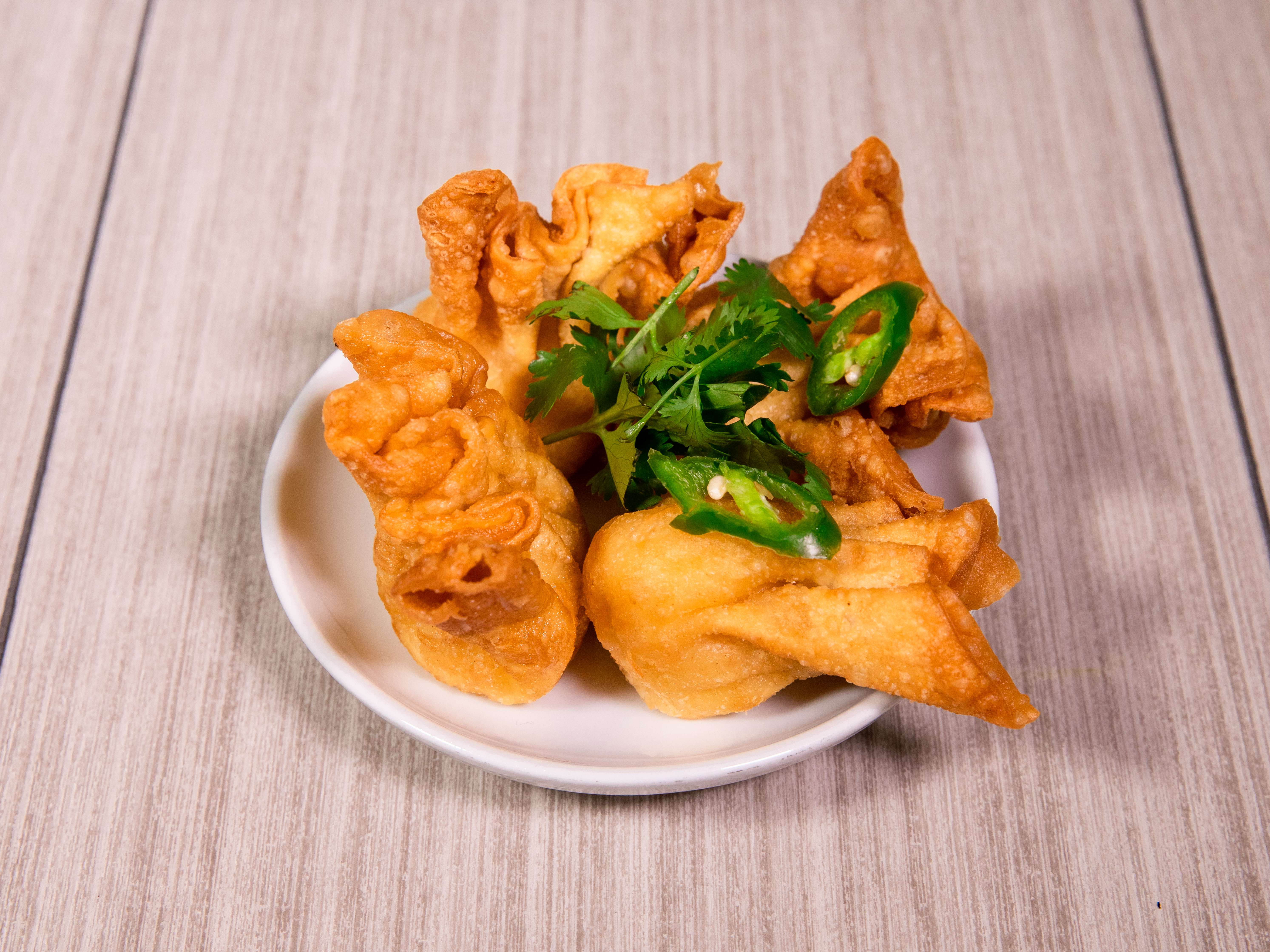 Order A9. Crab Rangoon food online from Hunan Garden Chinese Cuisine store, Katy on bringmethat.com