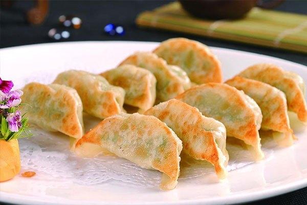 Order 8 Piece Pan-Fried Dumplings food online from China Dragon store, Baltimore on bringmethat.com
