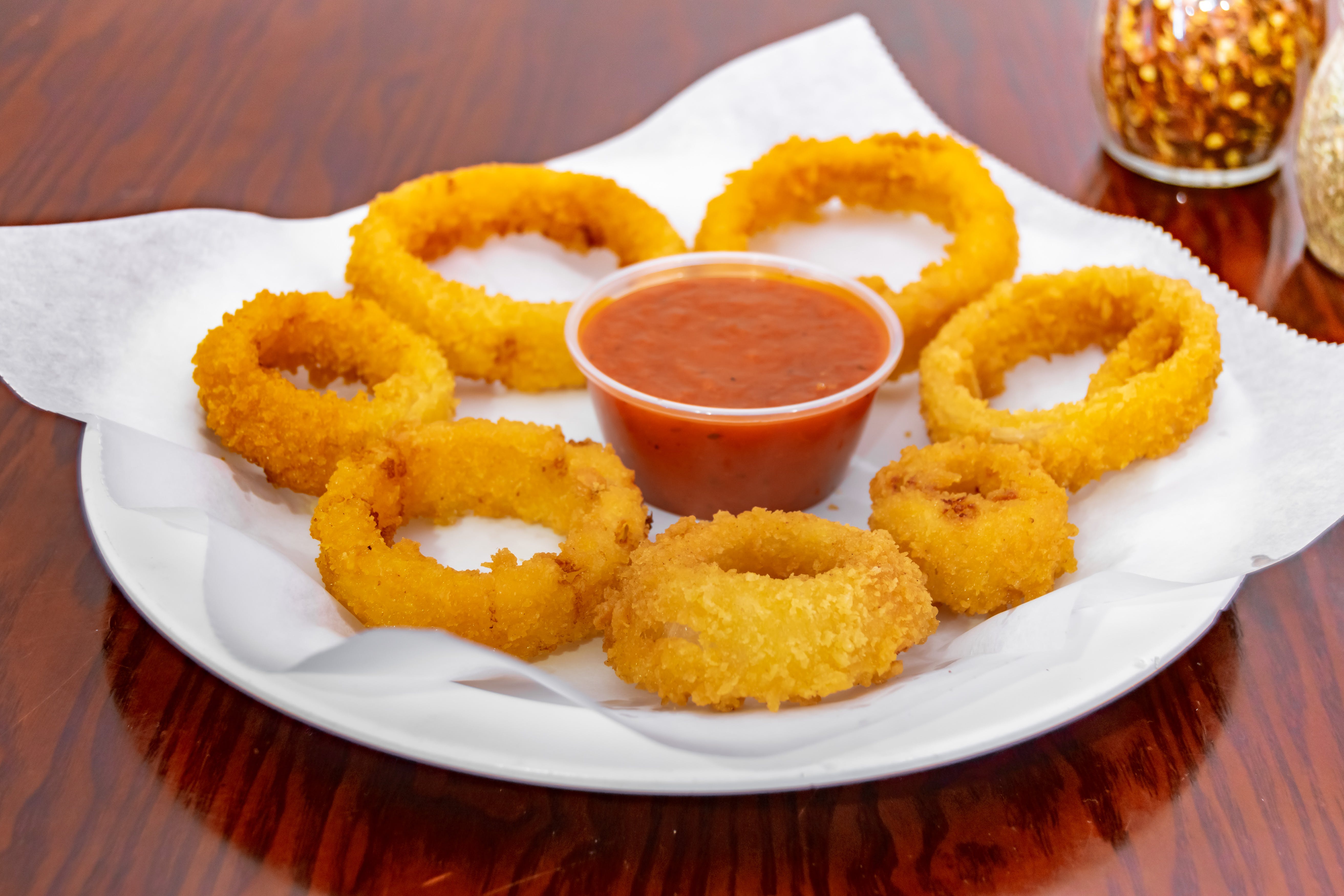 Order Onion Rings - Side food online from Giovannis Pizzeria store, Levittown on bringmethat.com