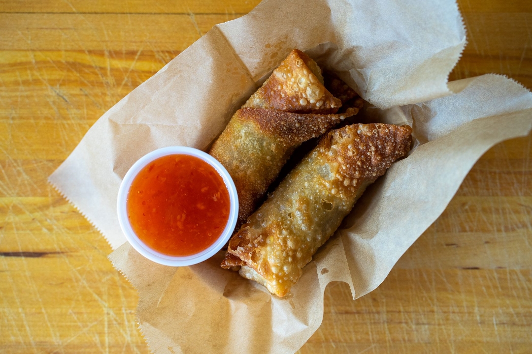 Order Pork egg rolls (2) with thai chili sauce food online from Rocklands Barbeque & Grilling Company store, Arlington on bringmethat.com