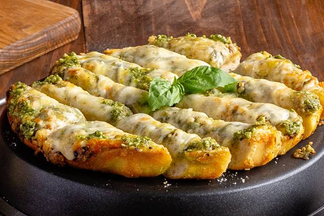 Order Cheesy Pesto Garlic Bread  food online from Uno Pizzeria & Grill store, Bensalem on bringmethat.com