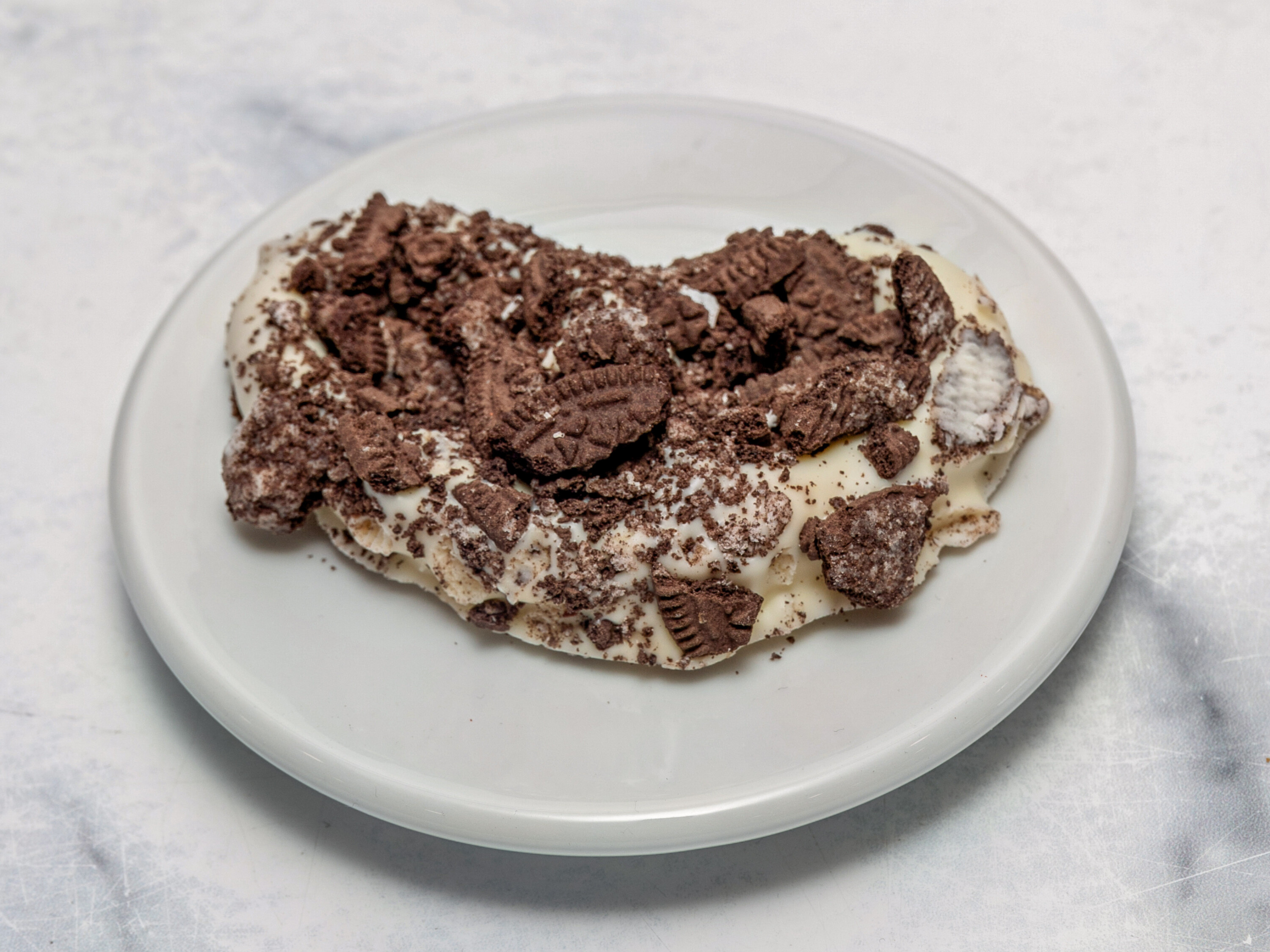Order White Chocolate Oreo Pretzel  food online from Sweet Spot Cafe store, Seaford on bringmethat.com