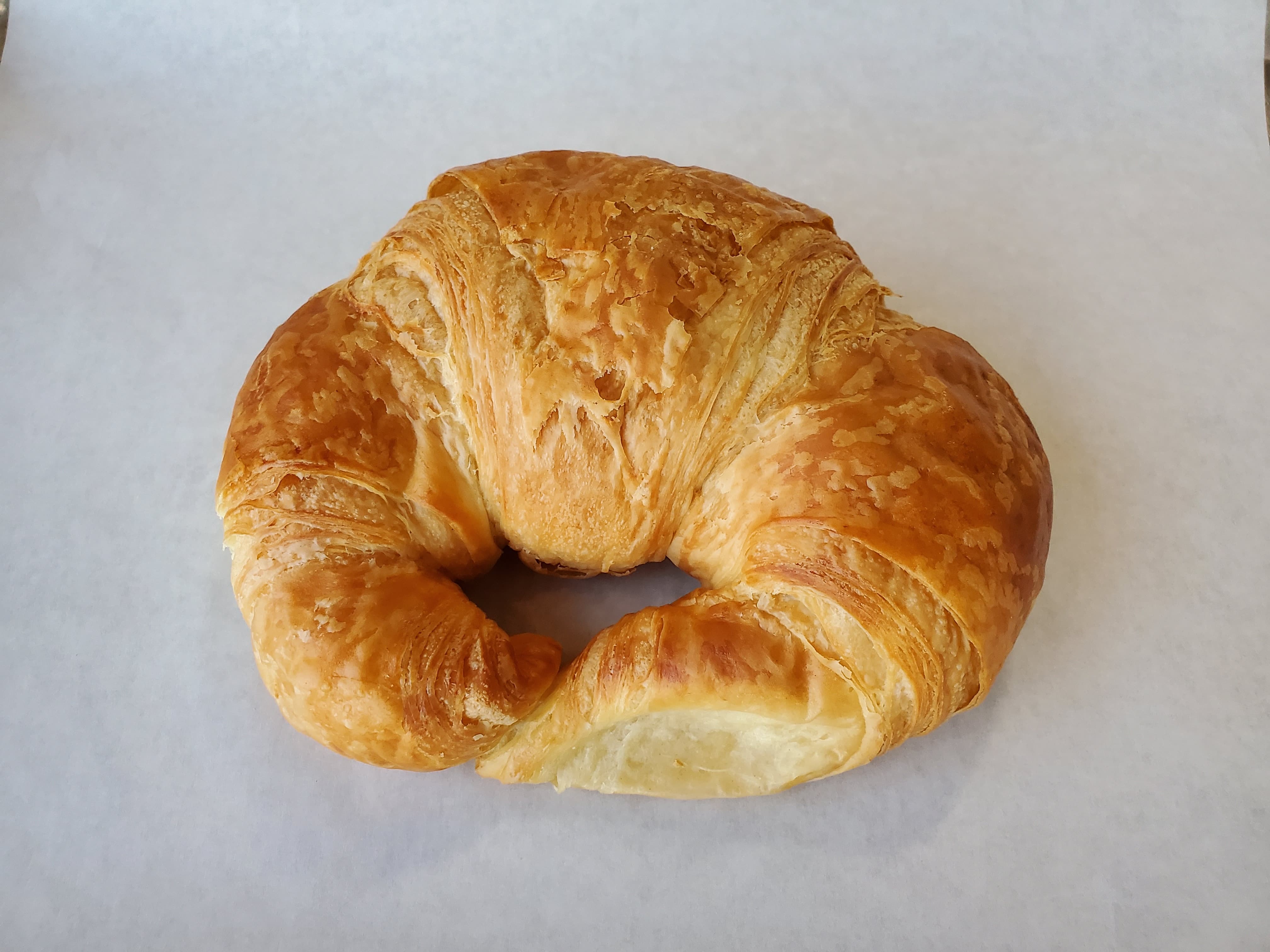 Order Plain Croissant food online from Honey Donuts store, Crowley on bringmethat.com