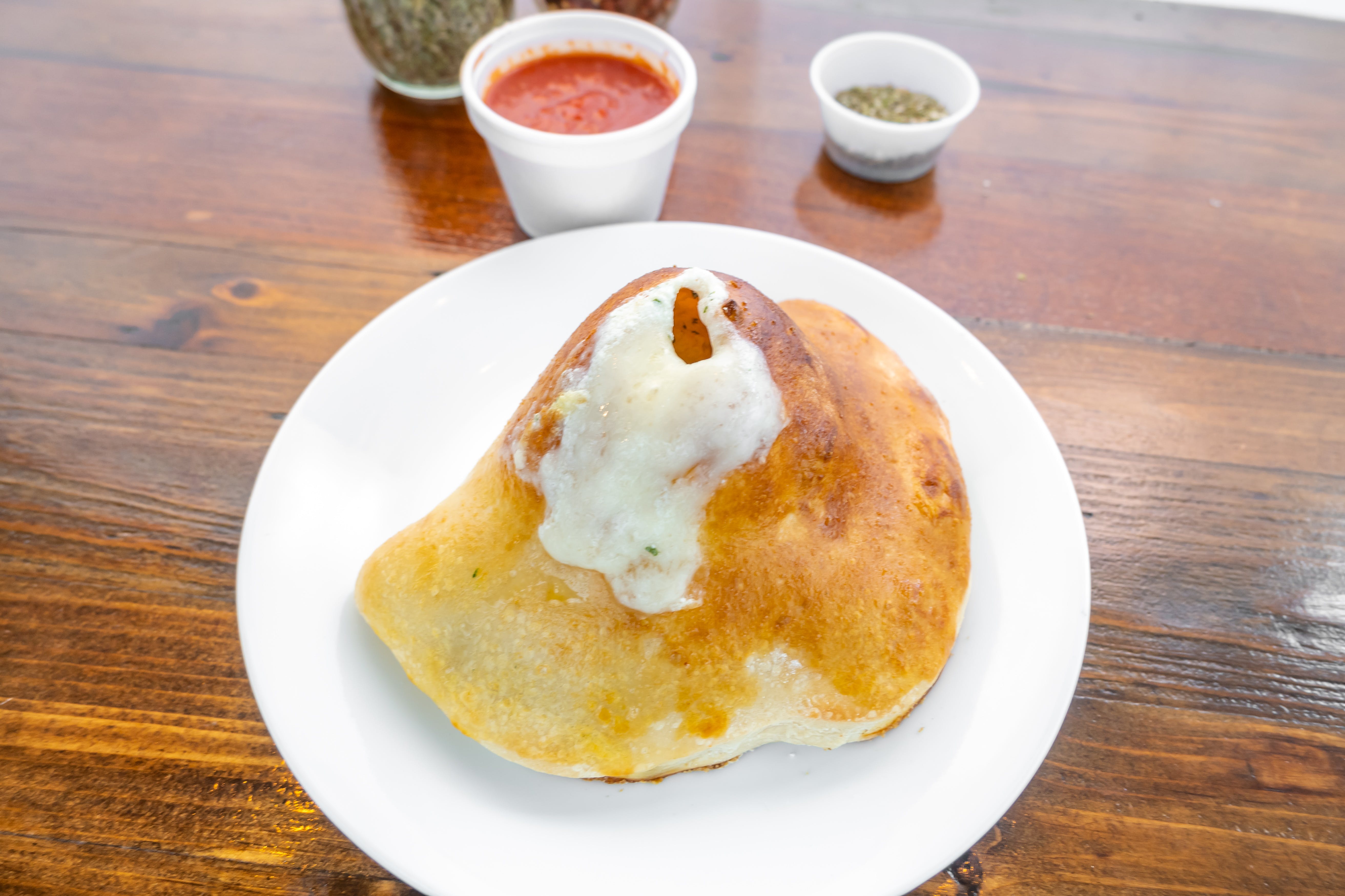 Order Cheezy Calzone - Calzone food online from Cosimos Pizza Cafe store, Philadelphia on bringmethat.com