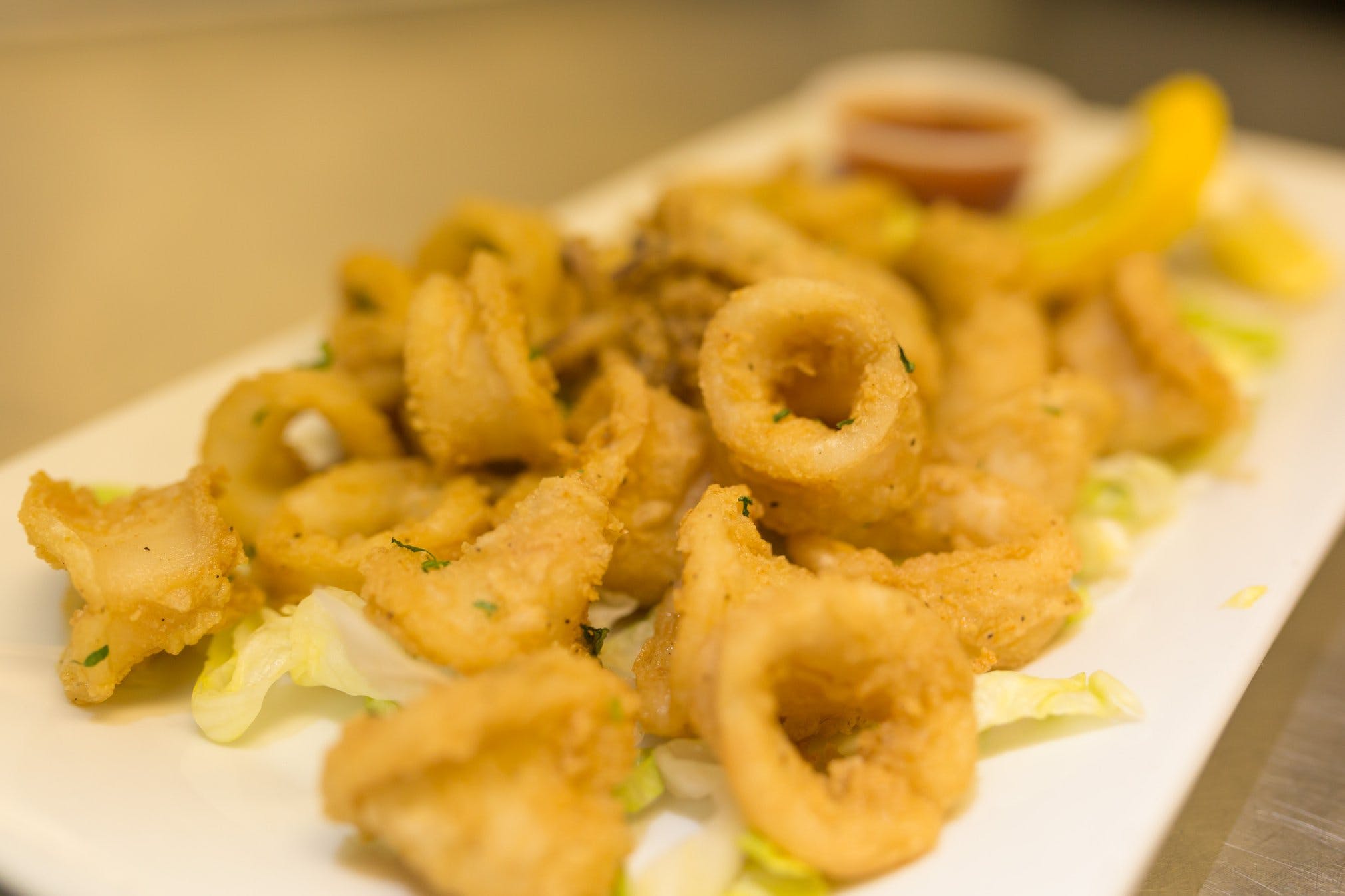 Order Calamari Fritti - Appetizer food online from Carmelo's Pizza, Pasta, Subs & More!! store, Linthicum Heights on bringmethat.com
