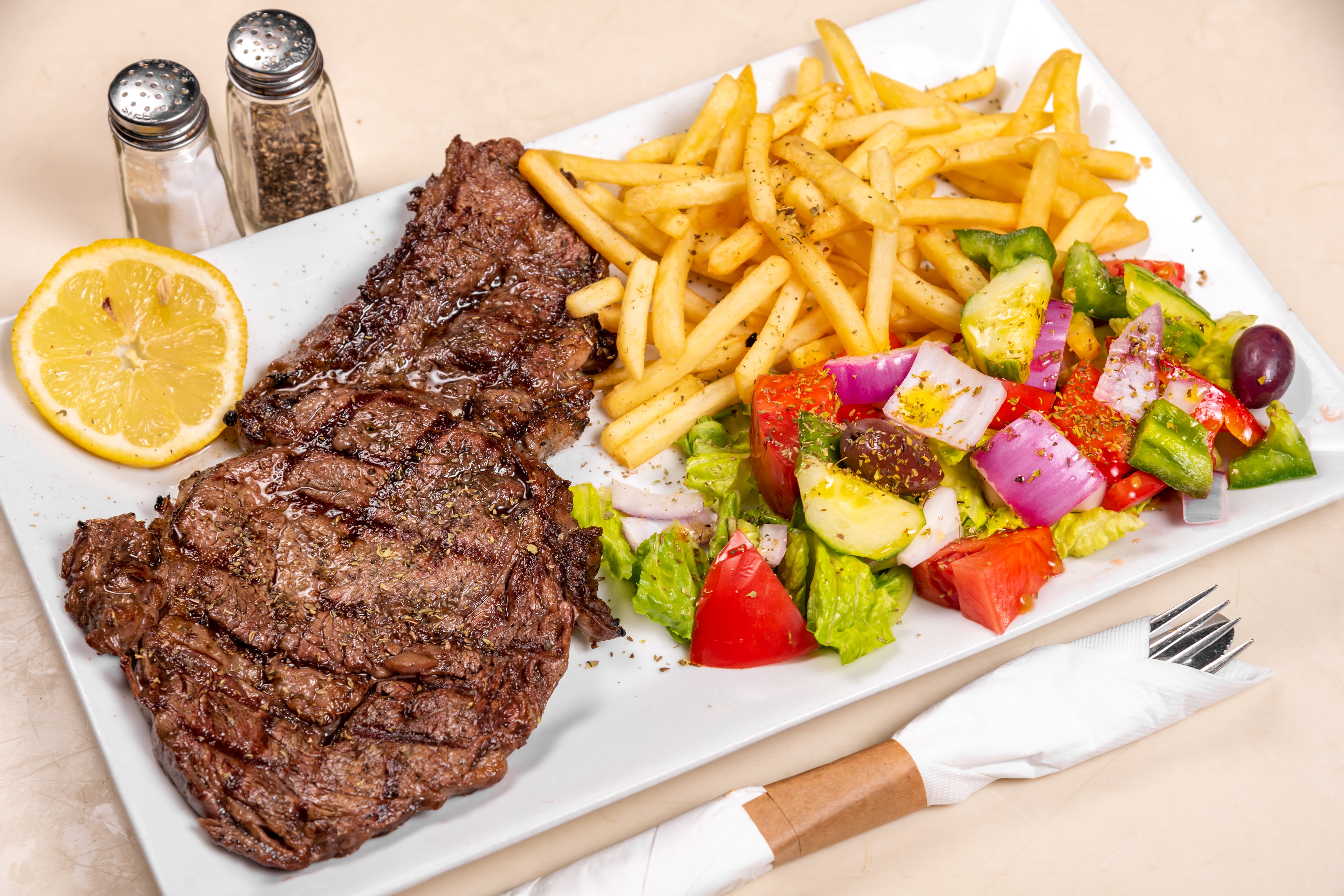 Order Rib Eye Steak Special - Special food online from Omonia Cafe store, Astoria on bringmethat.com