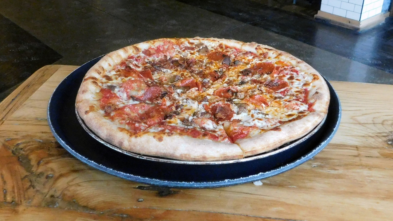 Order Meat Lovers Pizza food online from Junior's Bar and Grill store, Albany on bringmethat.com