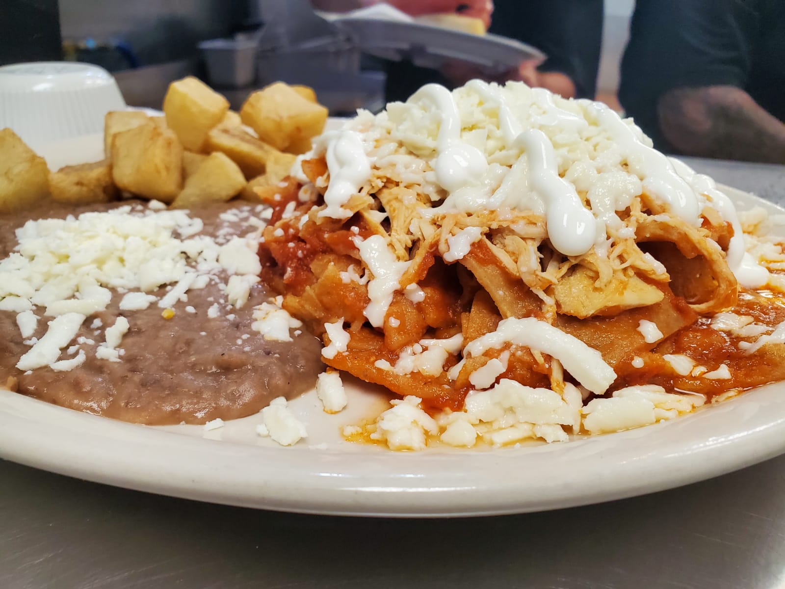 Order Chilaquiles with Chicken food online from Los Arcos Mexican Grill store, San Antonio on bringmethat.com
