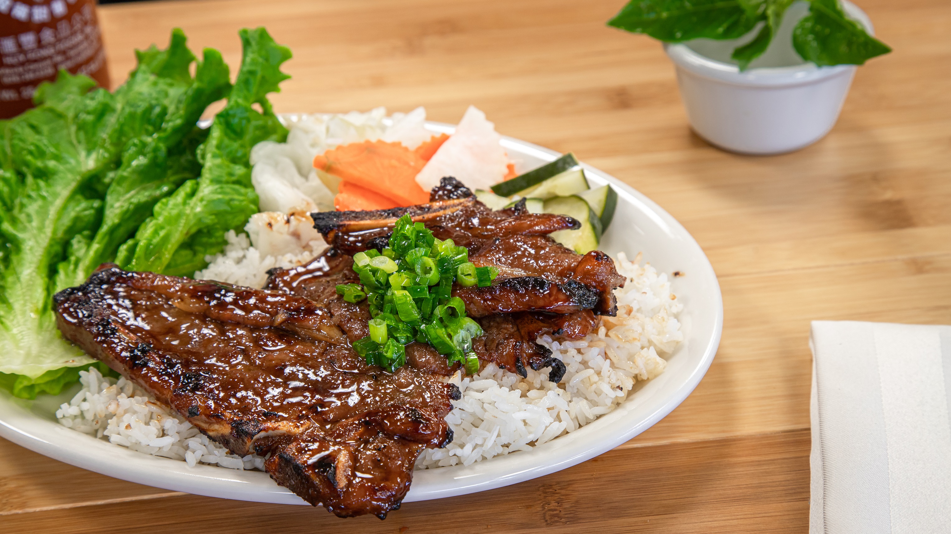 Order 26. Rice Flame Broiled Pork Chop food online from Pho Cafe Hong Kong Diner store, Reno on bringmethat.com
