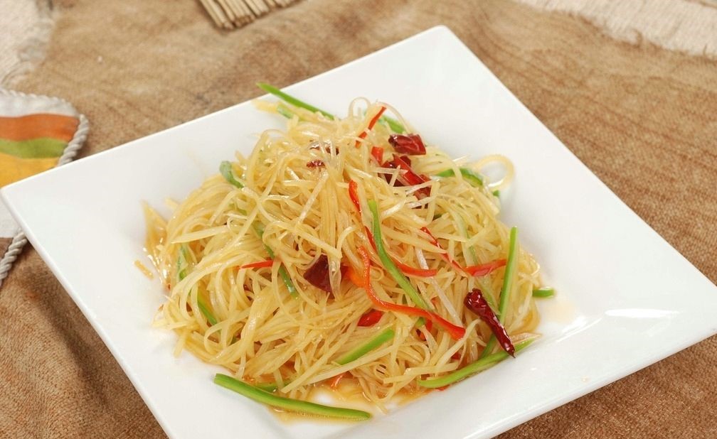 Order 60. Hot and Sour Shredded Potatoes 酸辣土豆丝 food online from Foshan Restaurant store, La Puente on bringmethat.com