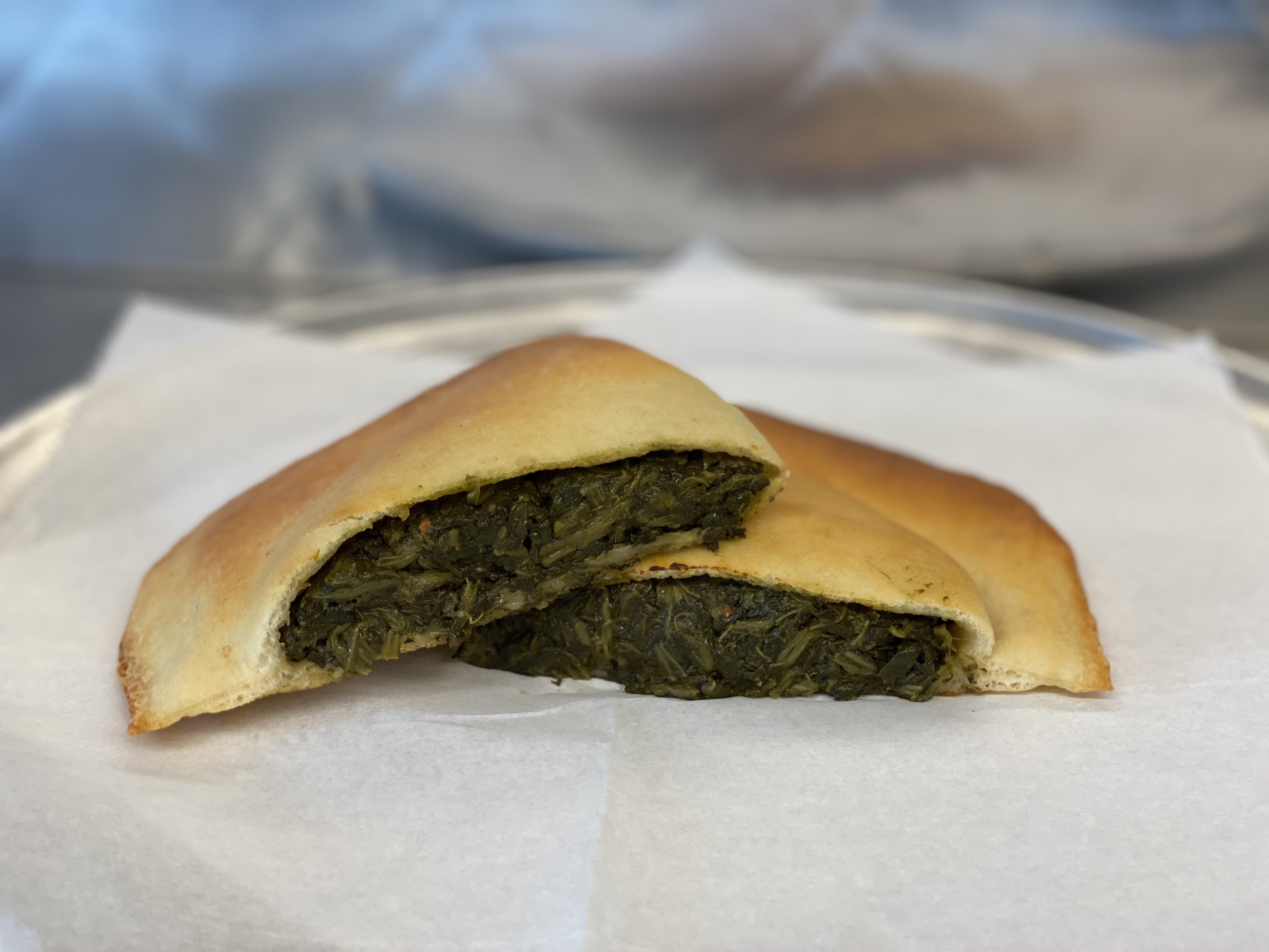 Order Spinach Pie food online from Caserta Pizzeria store, Providence on bringmethat.com