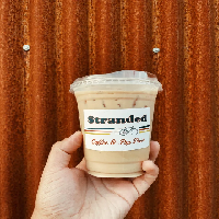 Order Iced Latte food online from Stranded Coffee store, San Antonio on bringmethat.com