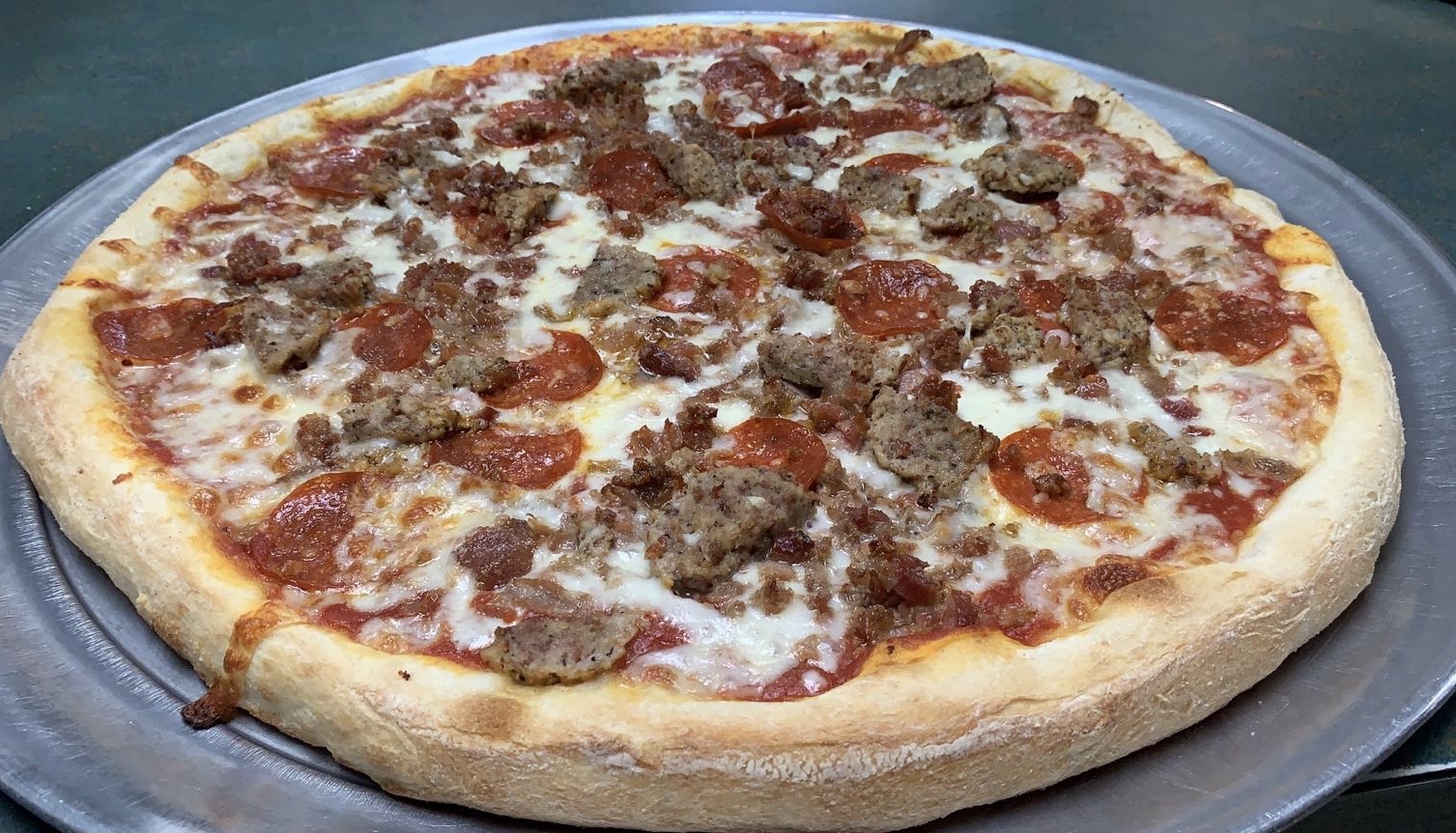 Order Meat Lovers Pizza food online from Tacos Pizza store, Bound Brook on bringmethat.com