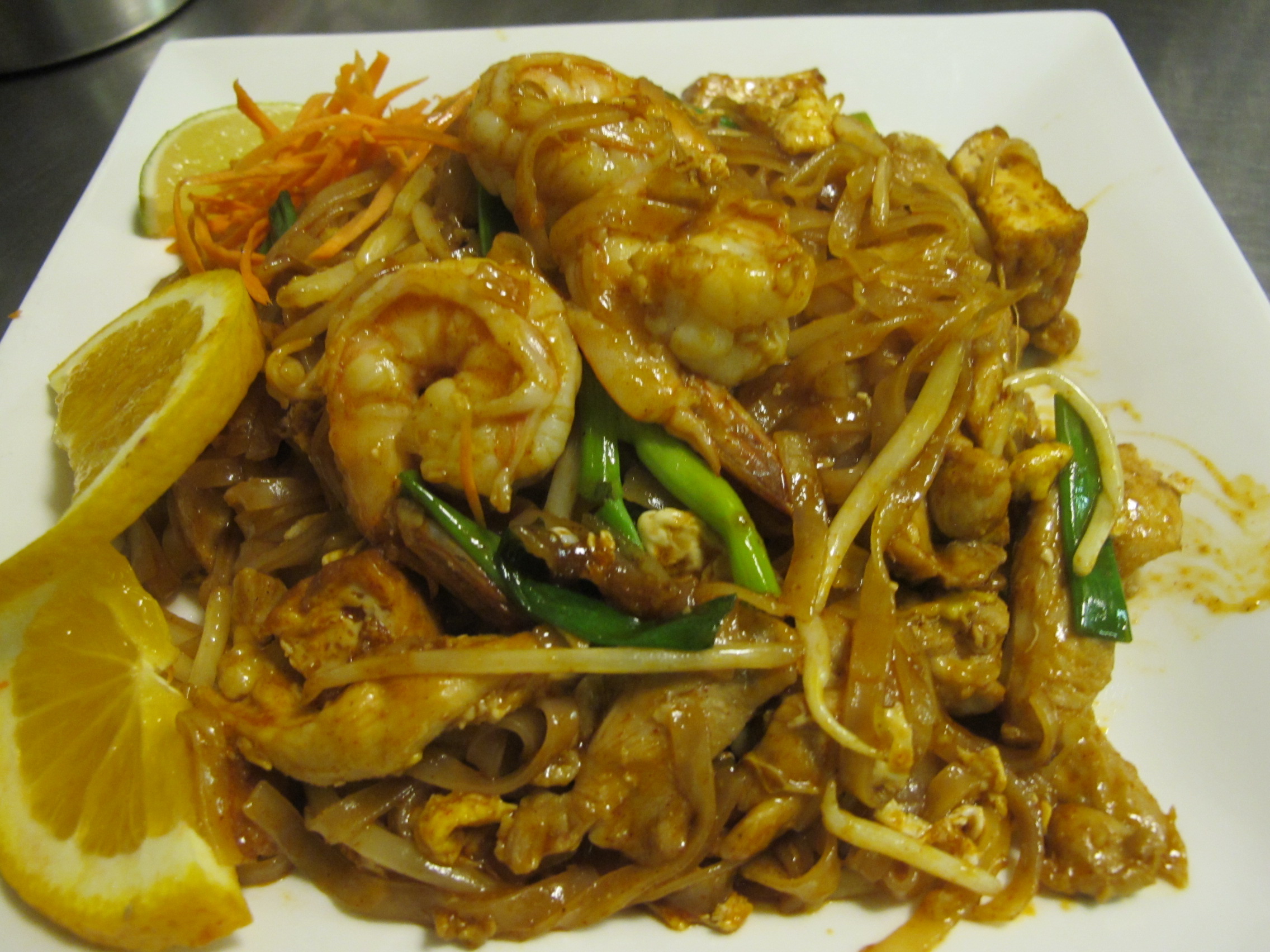Order 34. House Pad Thai (chicken+Tofu+shrimp) food online from Thailand Restaurant store, Modesto on bringmethat.com