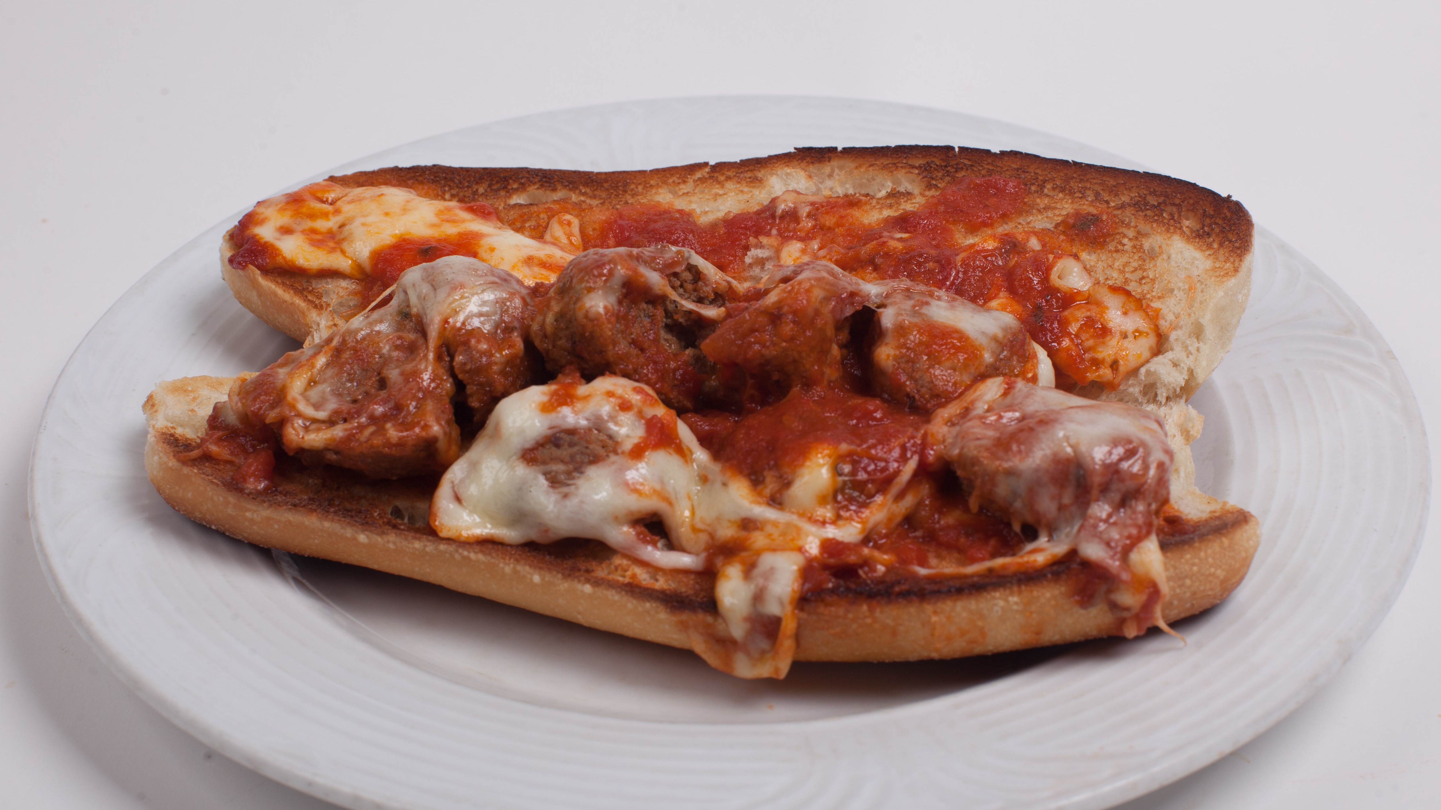 Order Meatball Parmigiana Hero food online from Umberto's Pizzeria store, New Hyde Park on bringmethat.com