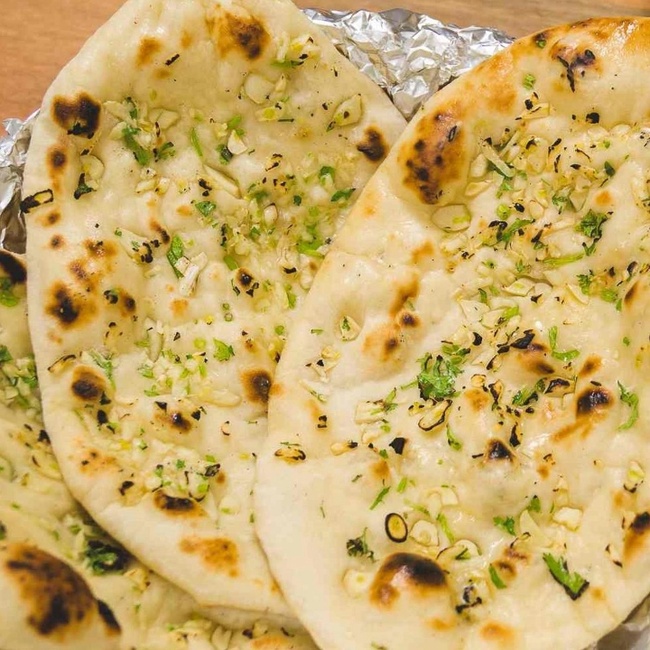 Order Garlic Naan food online from Mainland India Restaurant store, Niles on bringmethat.com