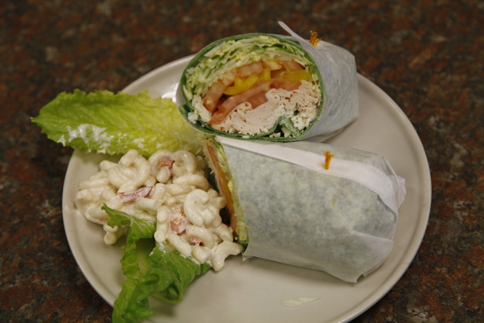 Order The Turkey Lovers Wrap food online from Redwood deli store, Forest Hills on bringmethat.com