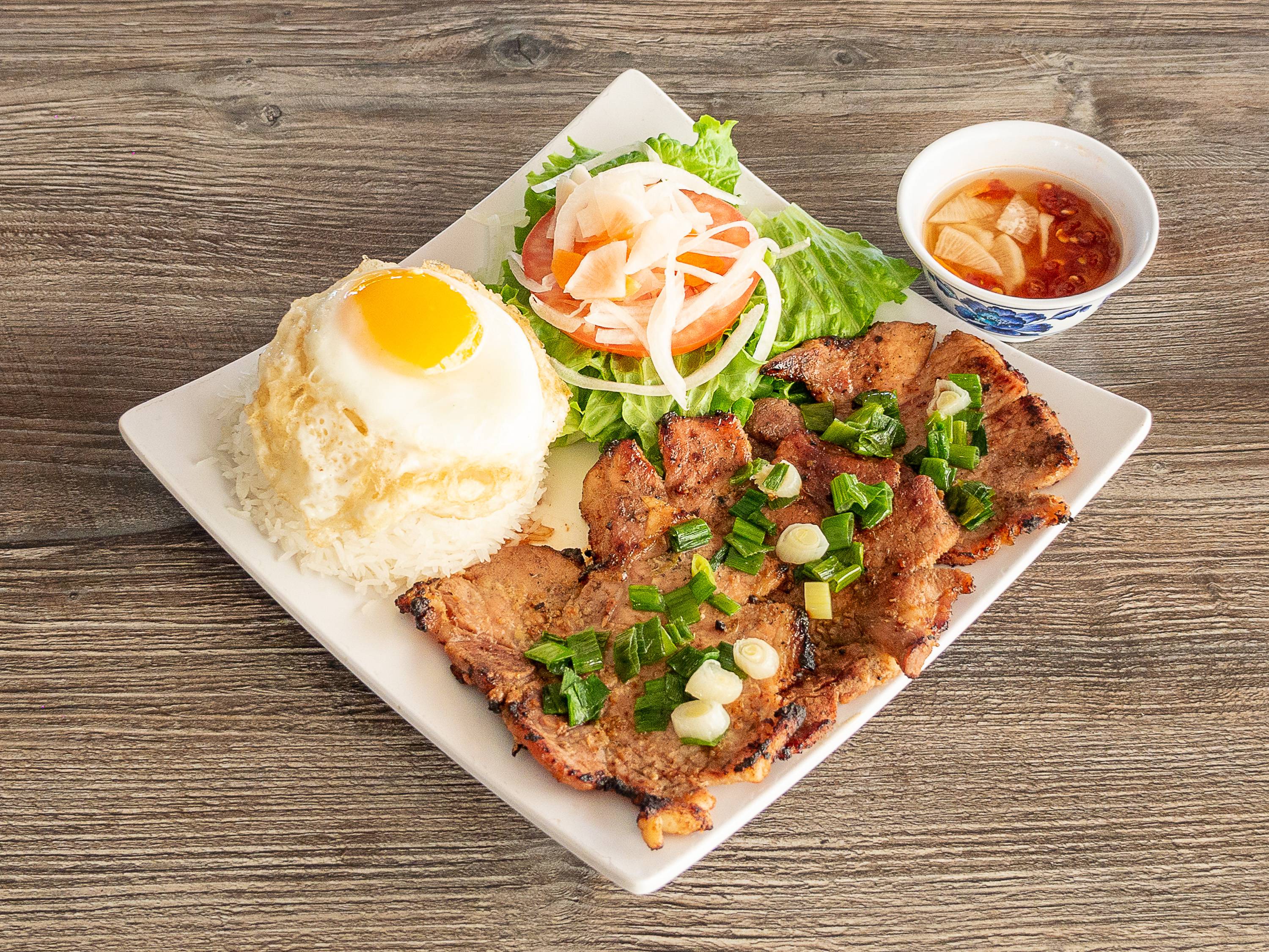 Order C2. Com Suon Trung Opla food online from Pho Tau Bay store, San Jose on bringmethat.com