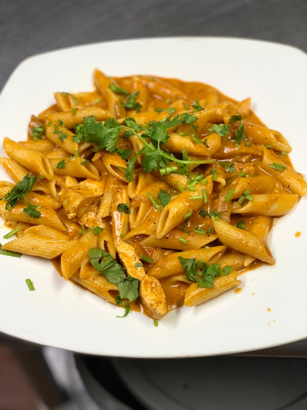 Order Penne con Pollo food online from Caridad store, Bronx on bringmethat.com
