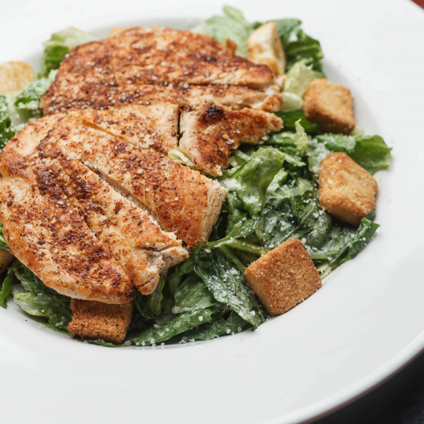 Order Caesar Salad with Chicken food online from Oceana Grill store, New Orleans on bringmethat.com