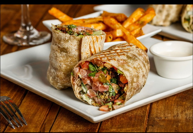 Order Chicken Shawarma Wrap (Spicy or Regular) food online from Mezza Grille store, Houston on bringmethat.com