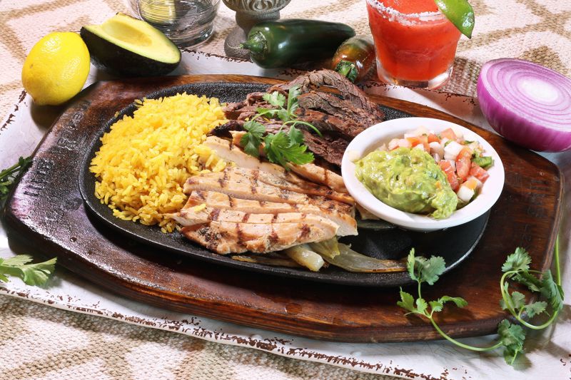 Order Fajitas Traditional (2) food online from Cilantros Mexican Restaurant store, Houston on bringmethat.com