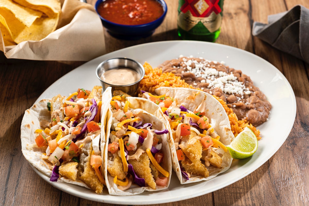 Order Dos XX® Fish Tacos food online from On The Border store, Westland on bringmethat.com