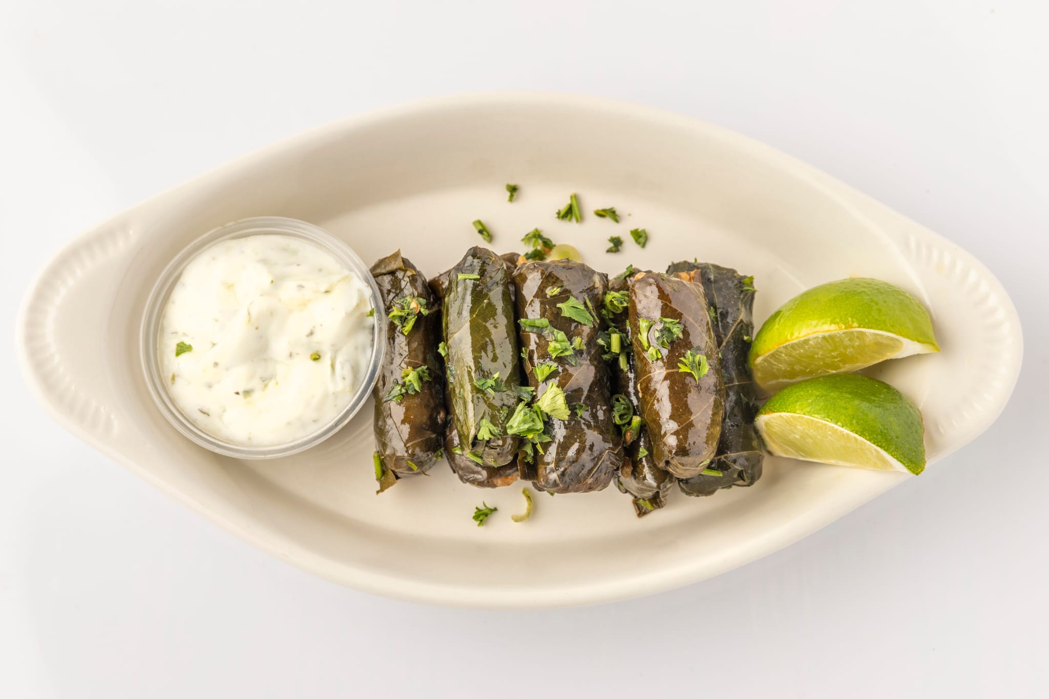 Order Grape Leaves with Yogurt  food online from Cairo Restaurant & Cafe store, Anaheim on bringmethat.com