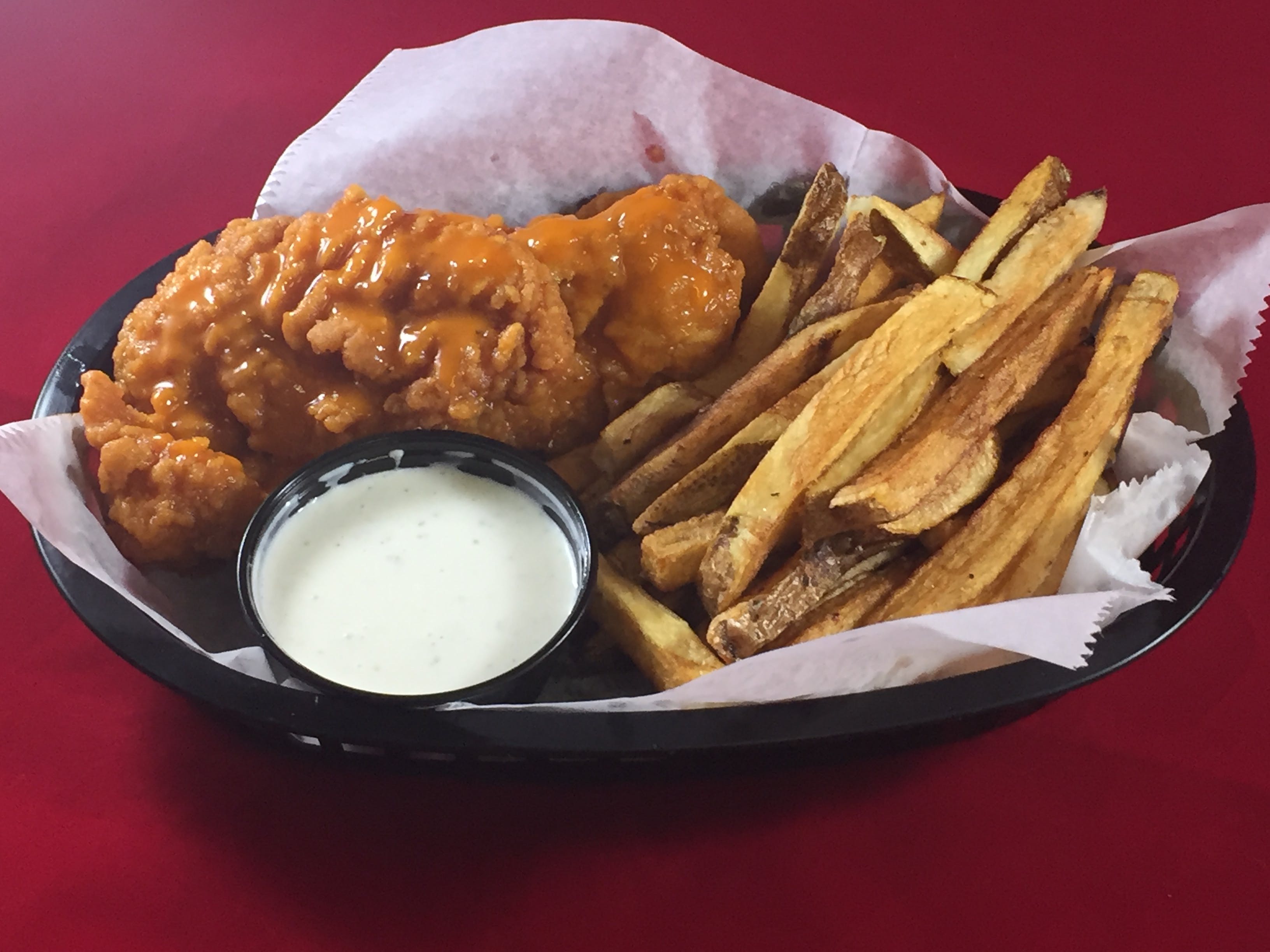 Order Buffalo Chicken Tenders with Fries - Appetizer food online from Tomatoes store, Carnegie on bringmethat.com