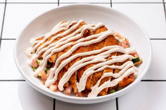 Order Schnitzel Salad food online from 12 chairs store, New York on bringmethat.com