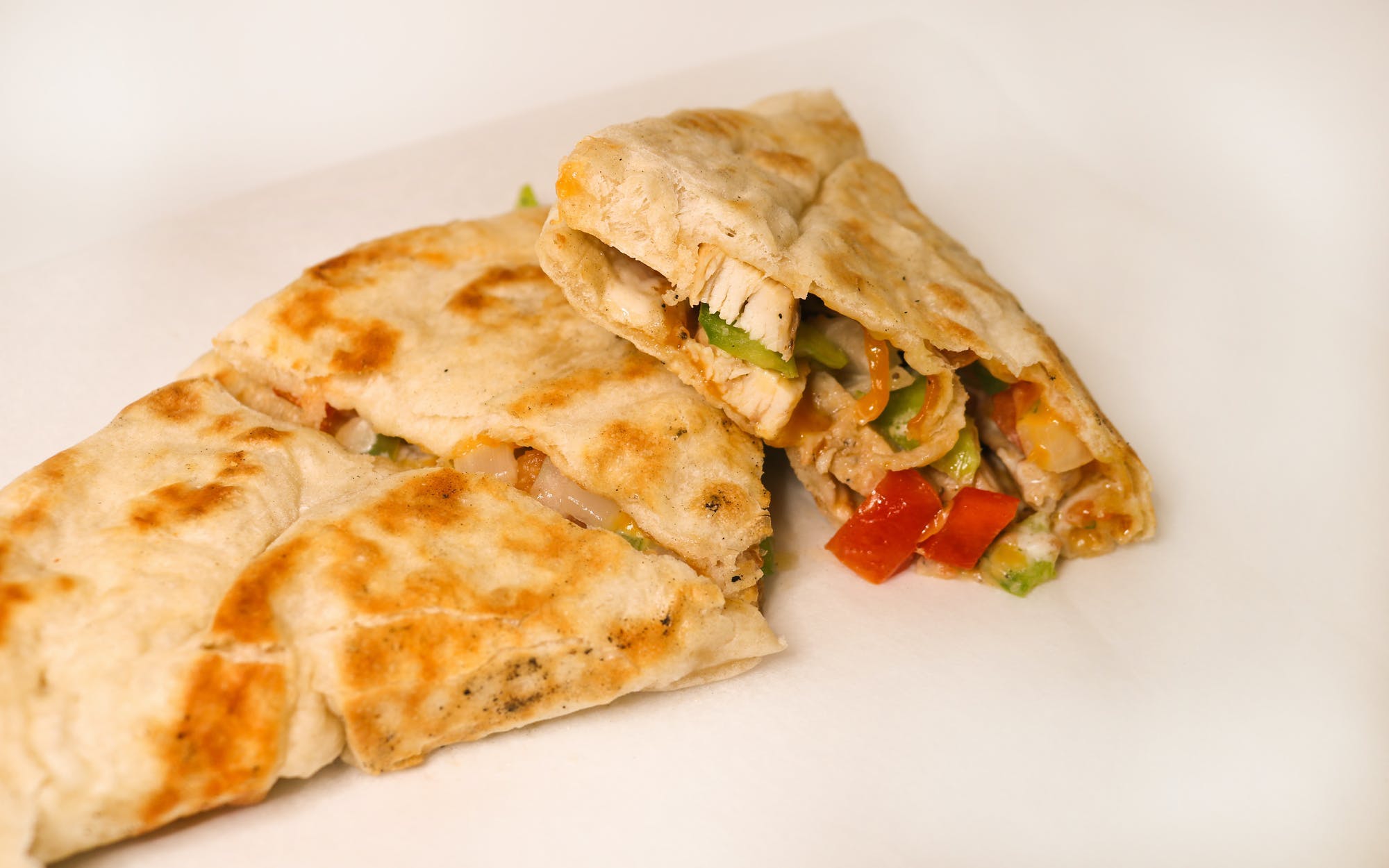 Order Nacho Chix Pizzadilla - Regular food online from Muncheez By Villa Pizza store, North Olmsted on bringmethat.com