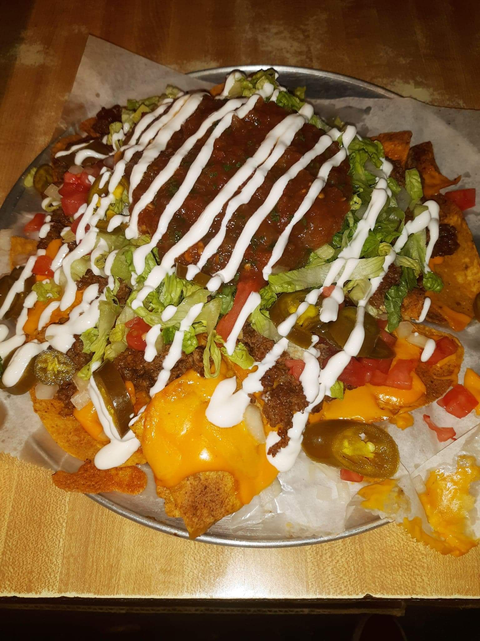 Order Beef Nacho's Loaded food online from Famous City Billiards store, Creve Coeur on bringmethat.com