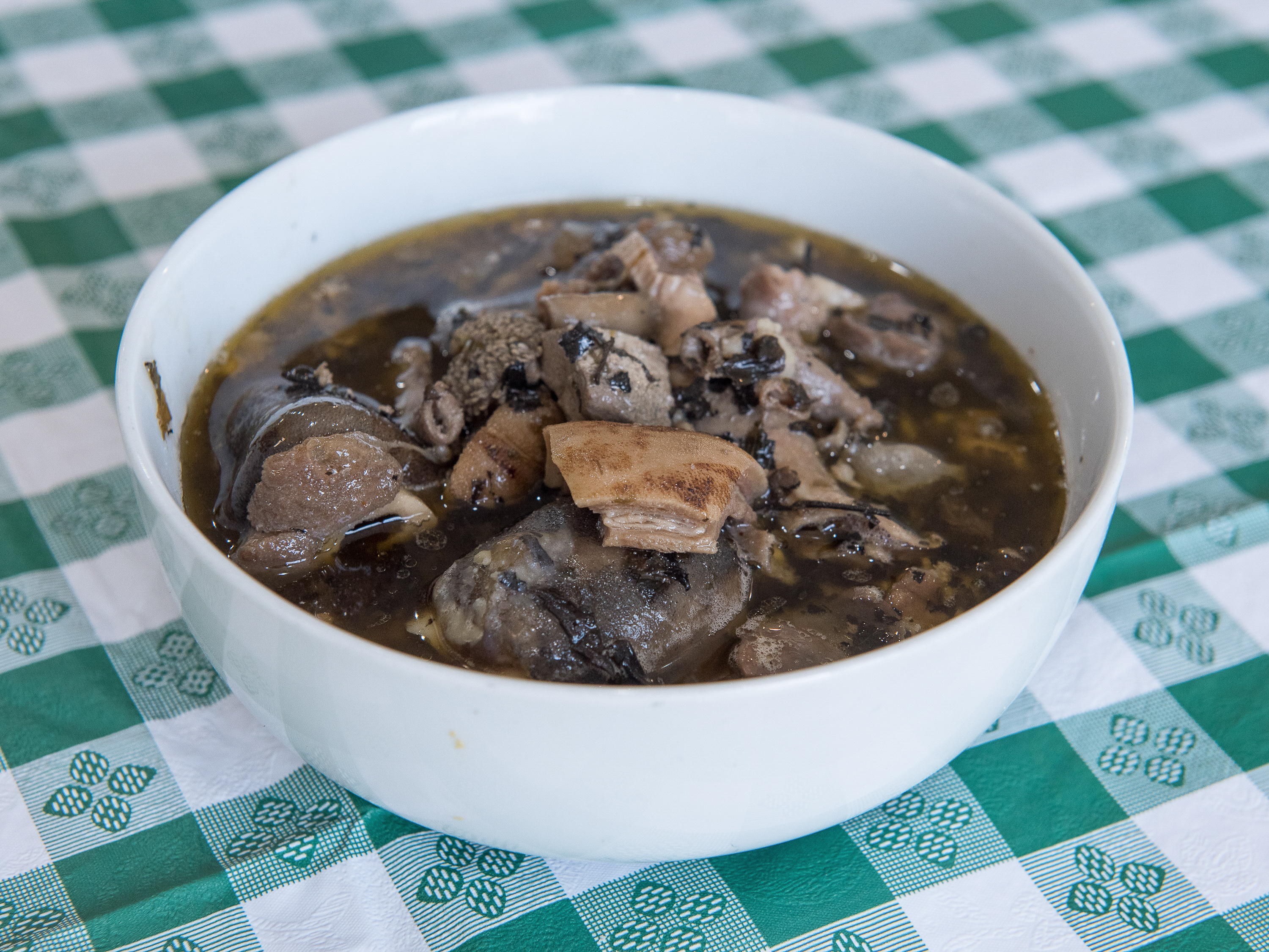 Order Pepper Soup with Assorted Goat Meat food online from Pat Delicious African Restaurant store, Columbus on bringmethat.com