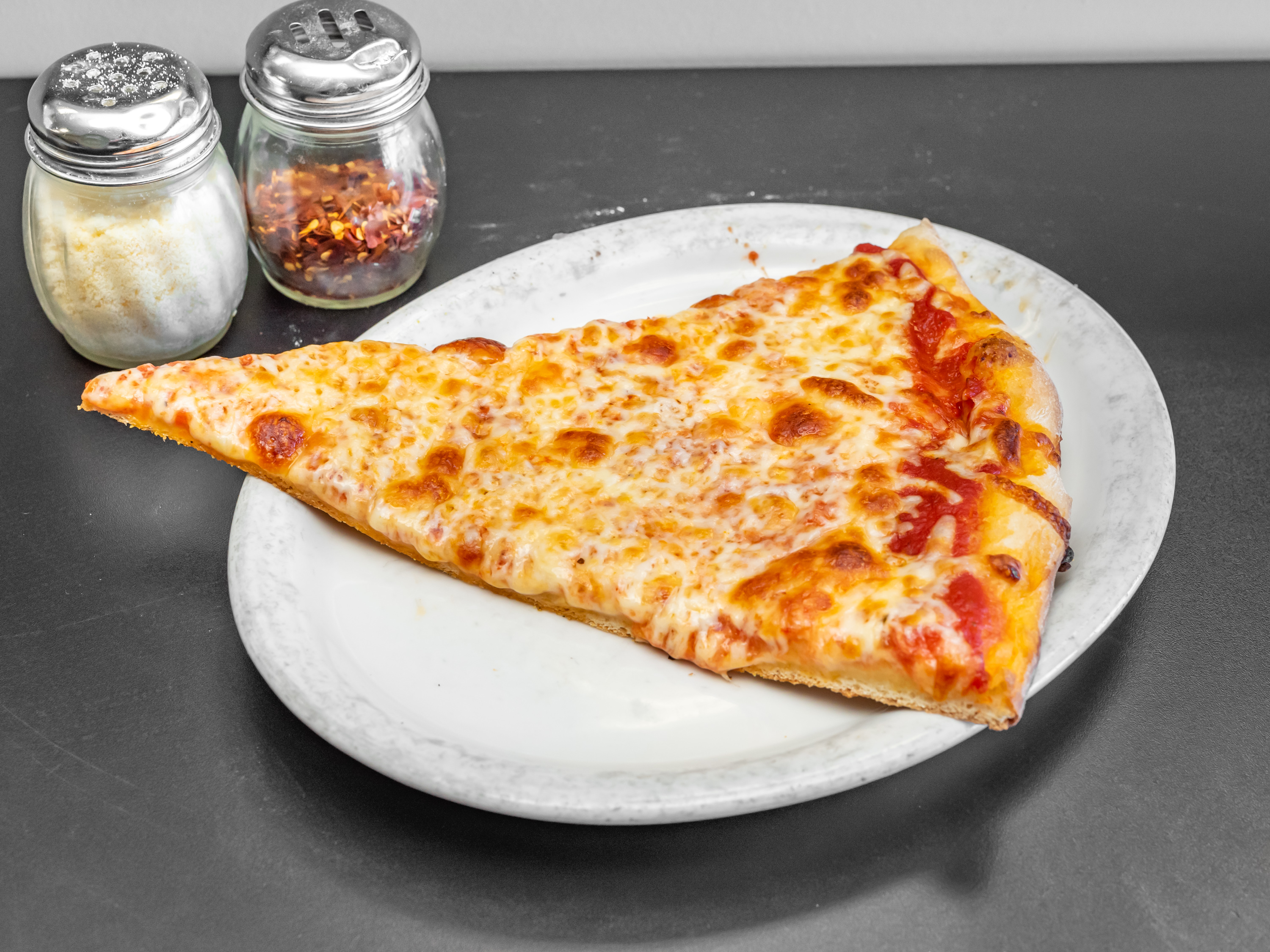 Order Cheese Pizza Slice food online from Tonti's Pizzeria store, Parker on bringmethat.com