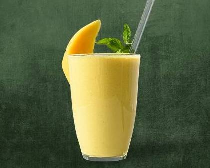 Order Mango Lassi food online from Made In India store, Austin on bringmethat.com