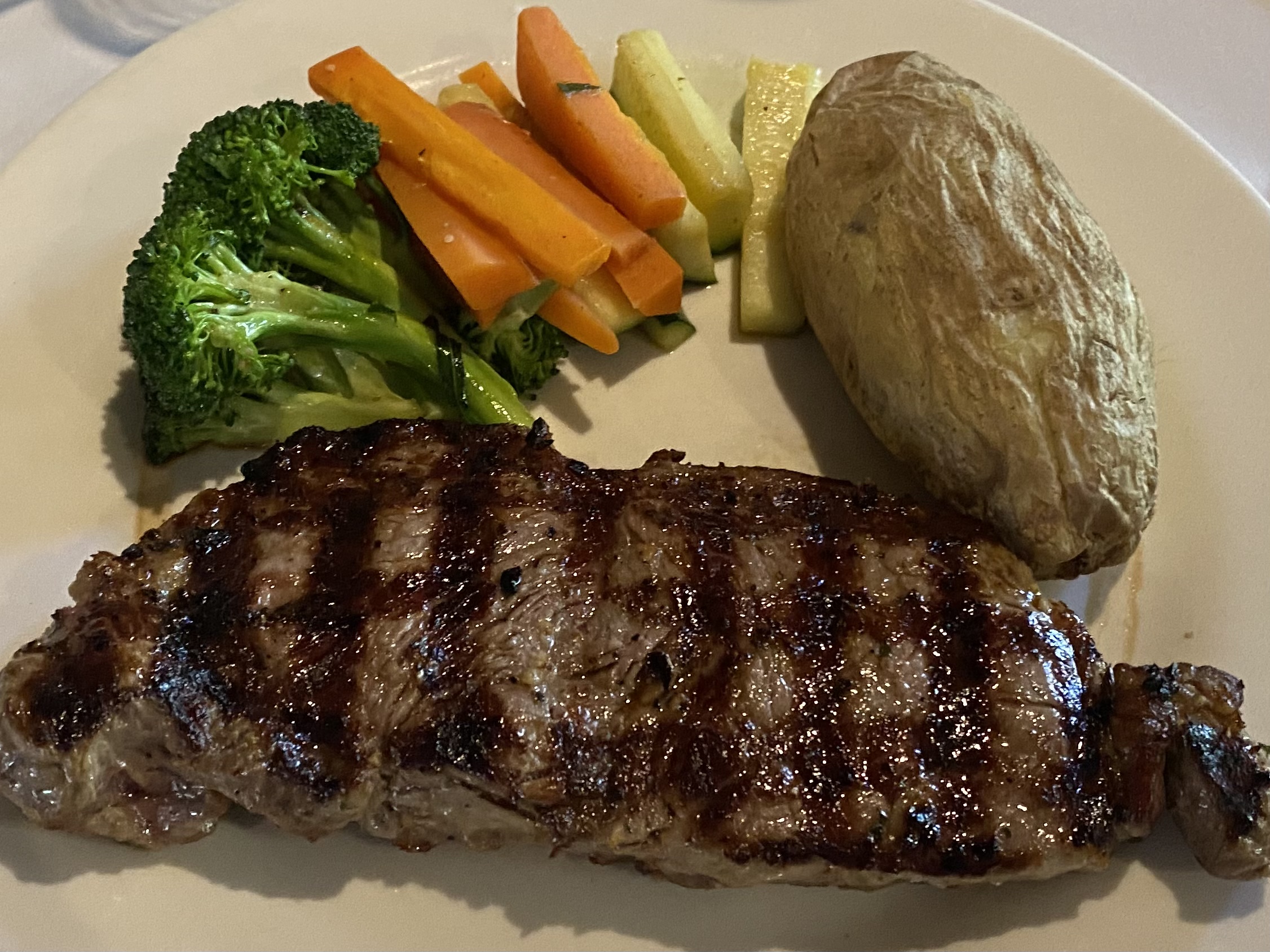 Order Grilled Boneless Shell Steak 12 oz. Cut food online from Cappuccino Cafe store, Brooklyn on bringmethat.com