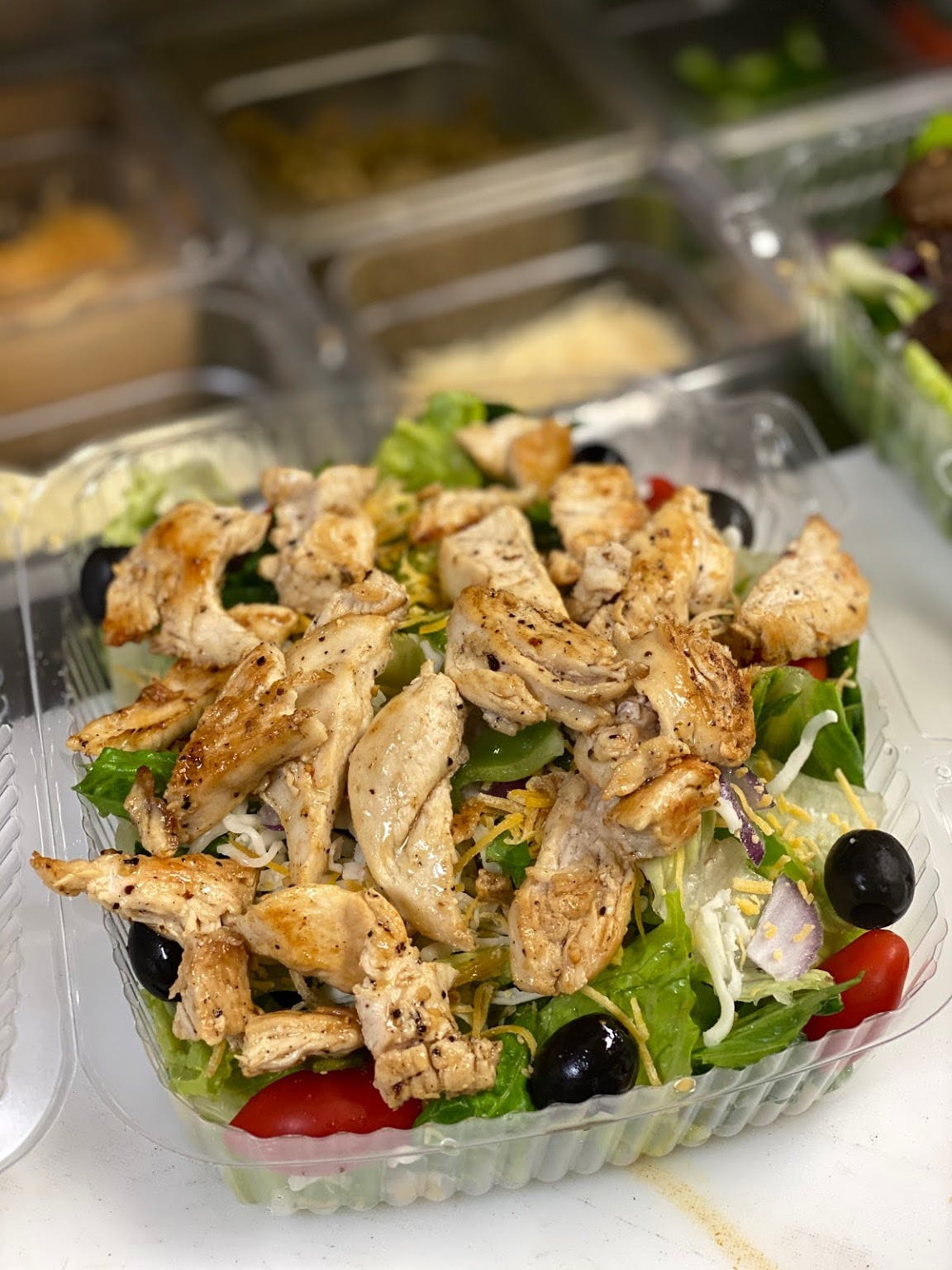 Order Grilled Chicken Salad - Salad food online from E Milano's Pizza store, Nashville on bringmethat.com