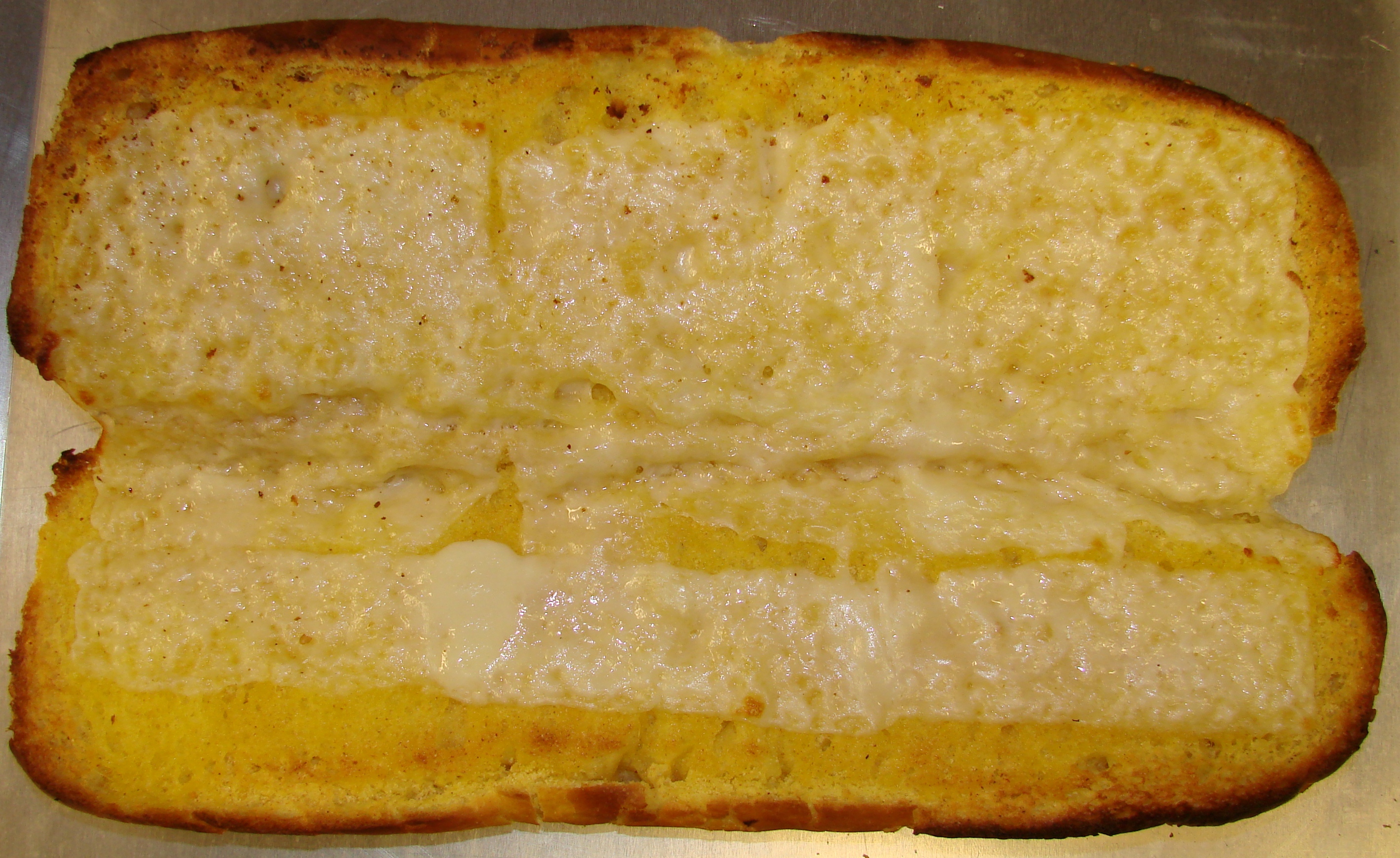 Order Garlic Loaf with Cheese food online from Calz Pizza Subs & Chicken Wings store, Virginia Beach on bringmethat.com