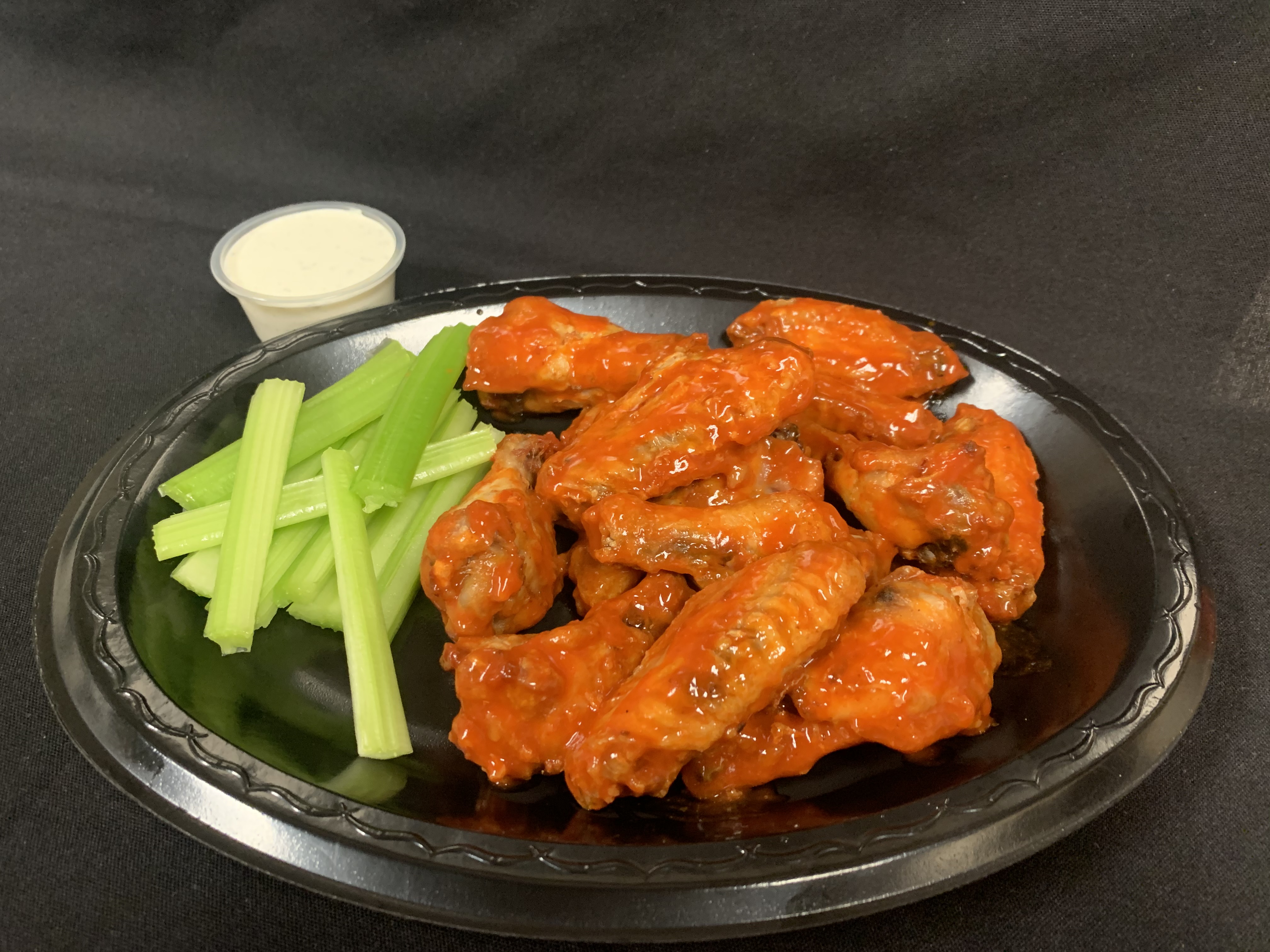 Order 12 Pieces Hot Wings food online from Tony Subs & Pizza store, Inglewood on bringmethat.com