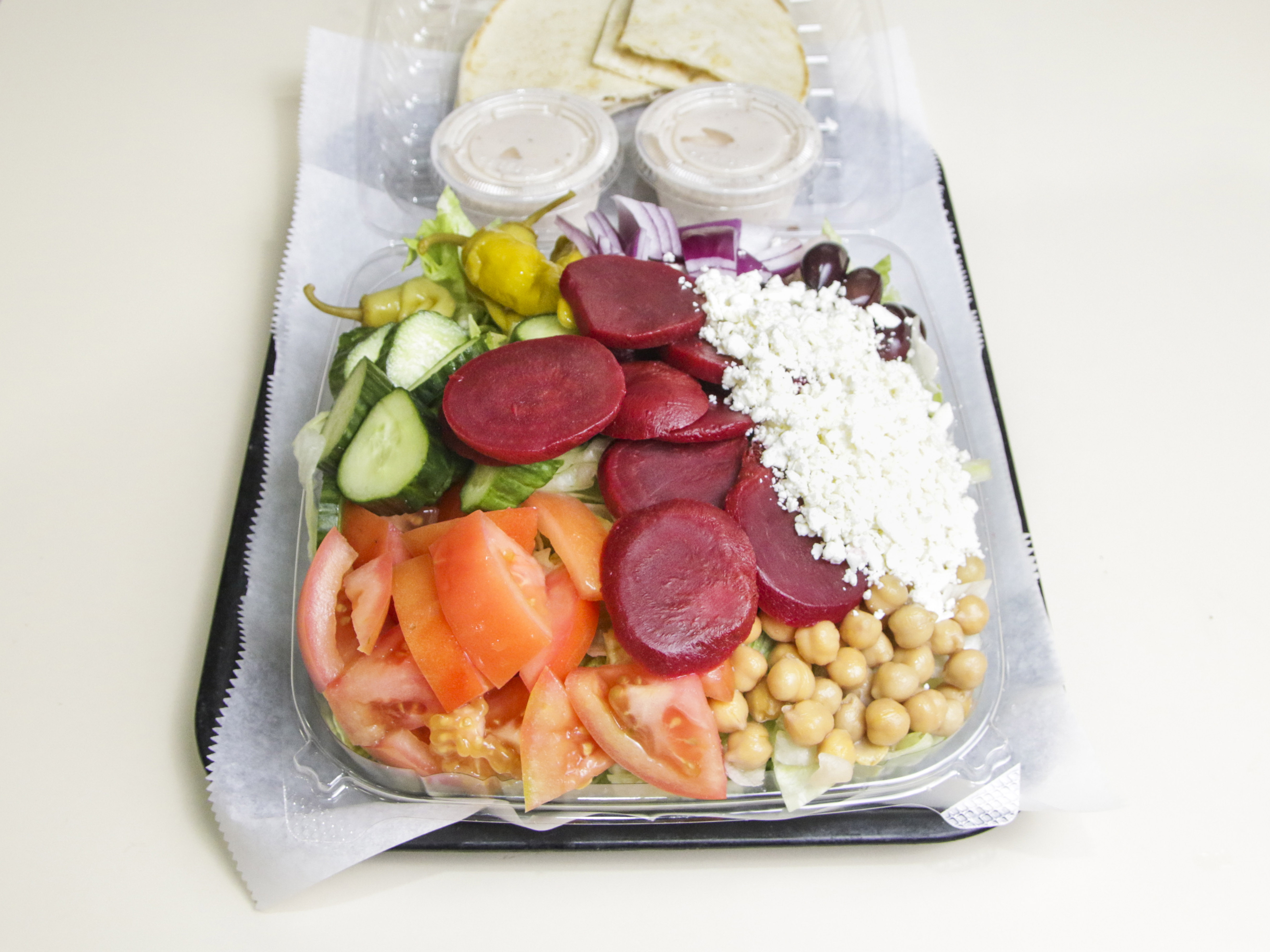 Order Medium Greek Salad food online from Pizza Kitchen store, Dearborn on bringmethat.com