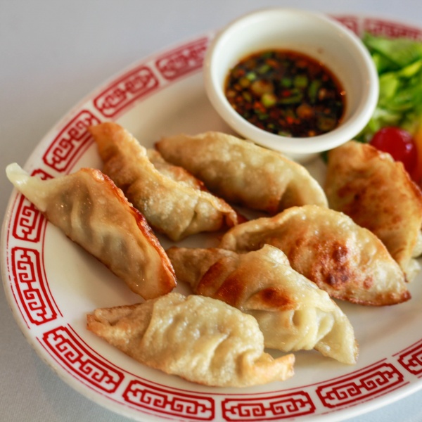 Order 9. Pork Dumplings food online from Oriental Express store, Old Forge on bringmethat.com