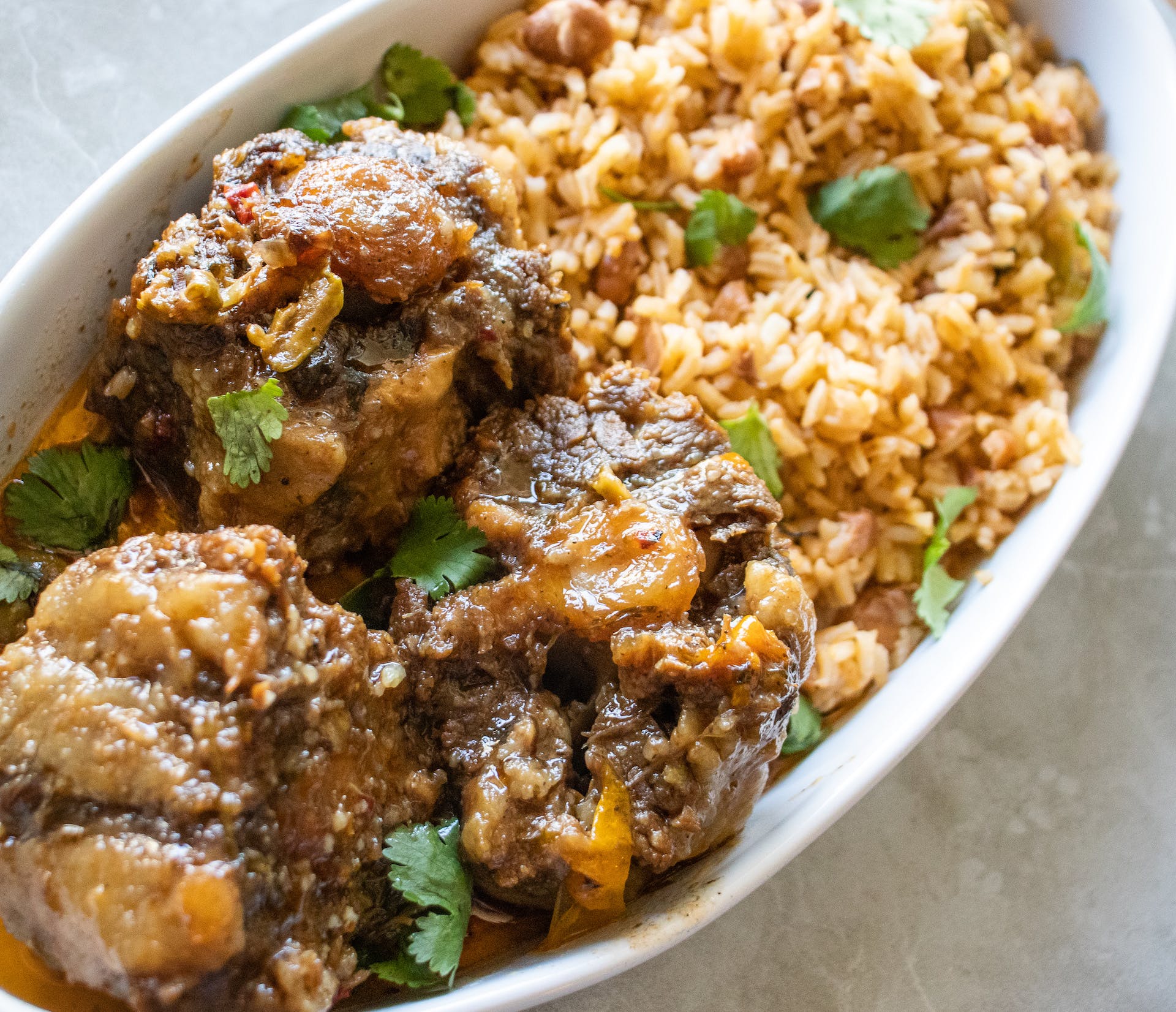 Order Oxtail with Rice - Jamaican food online from Best Pizza store, Atlanta on bringmethat.com