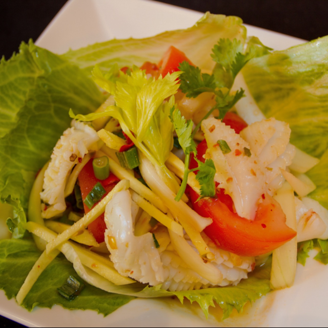Order Calamari Salad food online from Chabaa Thai Cuisine store, San Francisco on bringmethat.com
