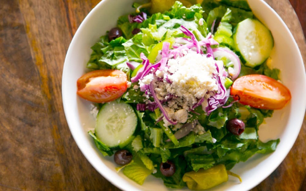 Order Greek Salad - Side food online from New York Pizzeria store, Houston on bringmethat.com