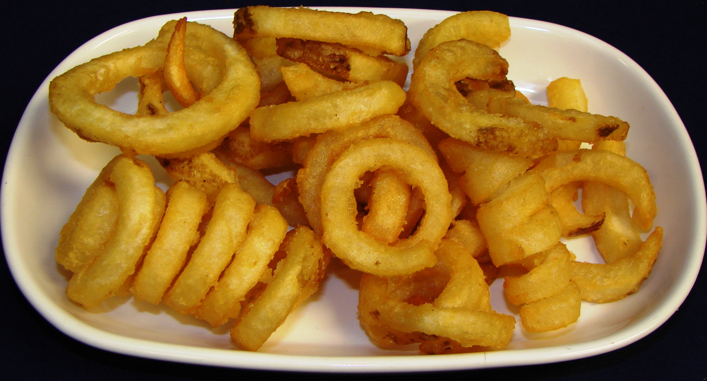 Order Curly Q Fries food online from Calz Pizza Subs & Chicken Wings store, Virginia Beach on bringmethat.com