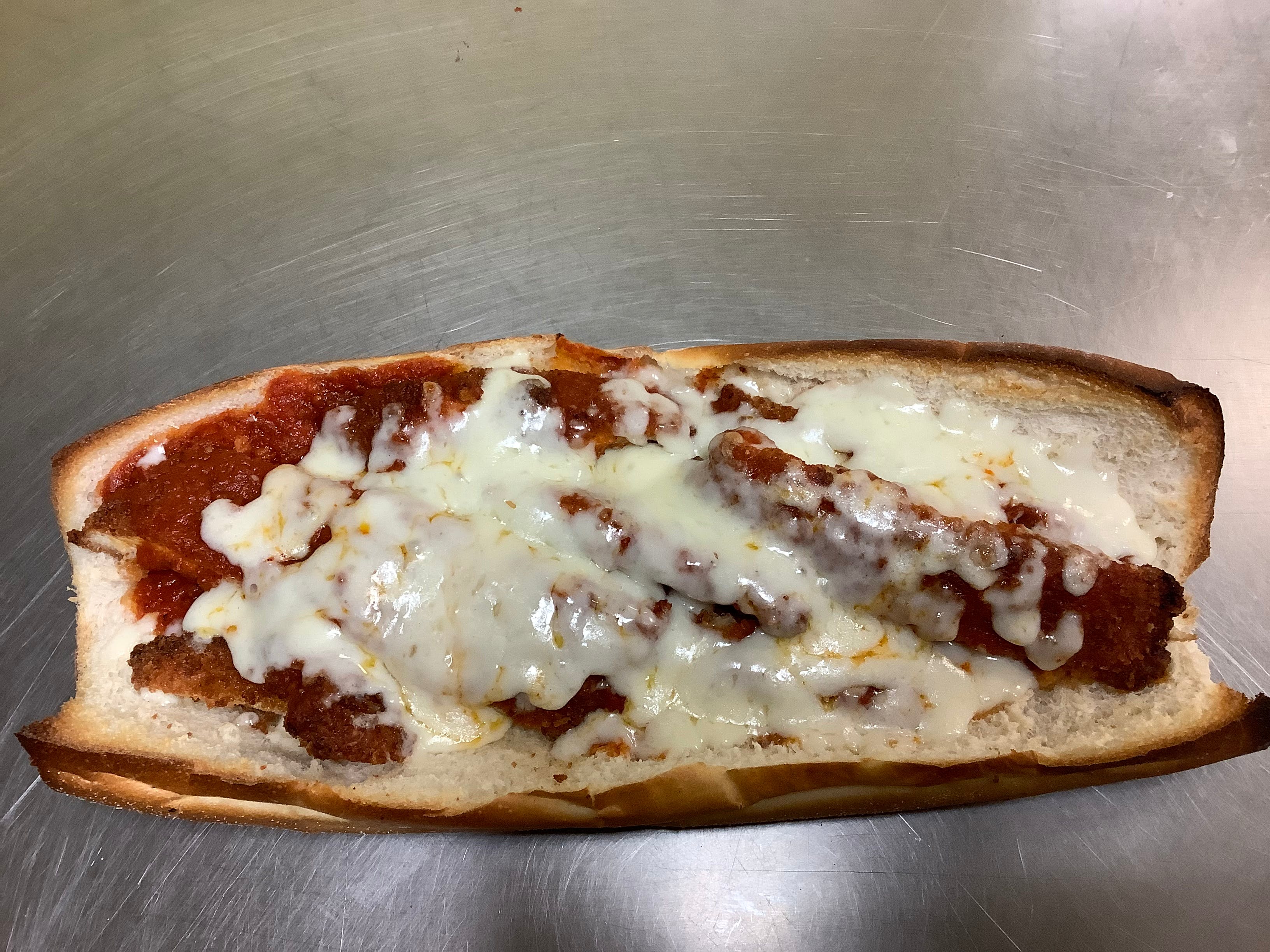 Order Chicken Parmigiana Sub - Sub food online from Ginos Pizza store, Lindenwold on bringmethat.com
