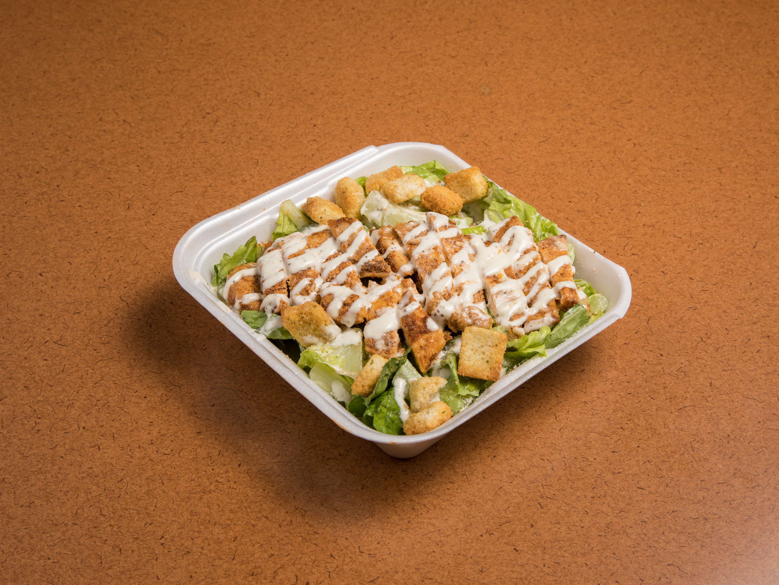 Order 42. Chicken Caesar Salad food online from Rinaldi Italian Deli store, Scottsdale on bringmethat.com