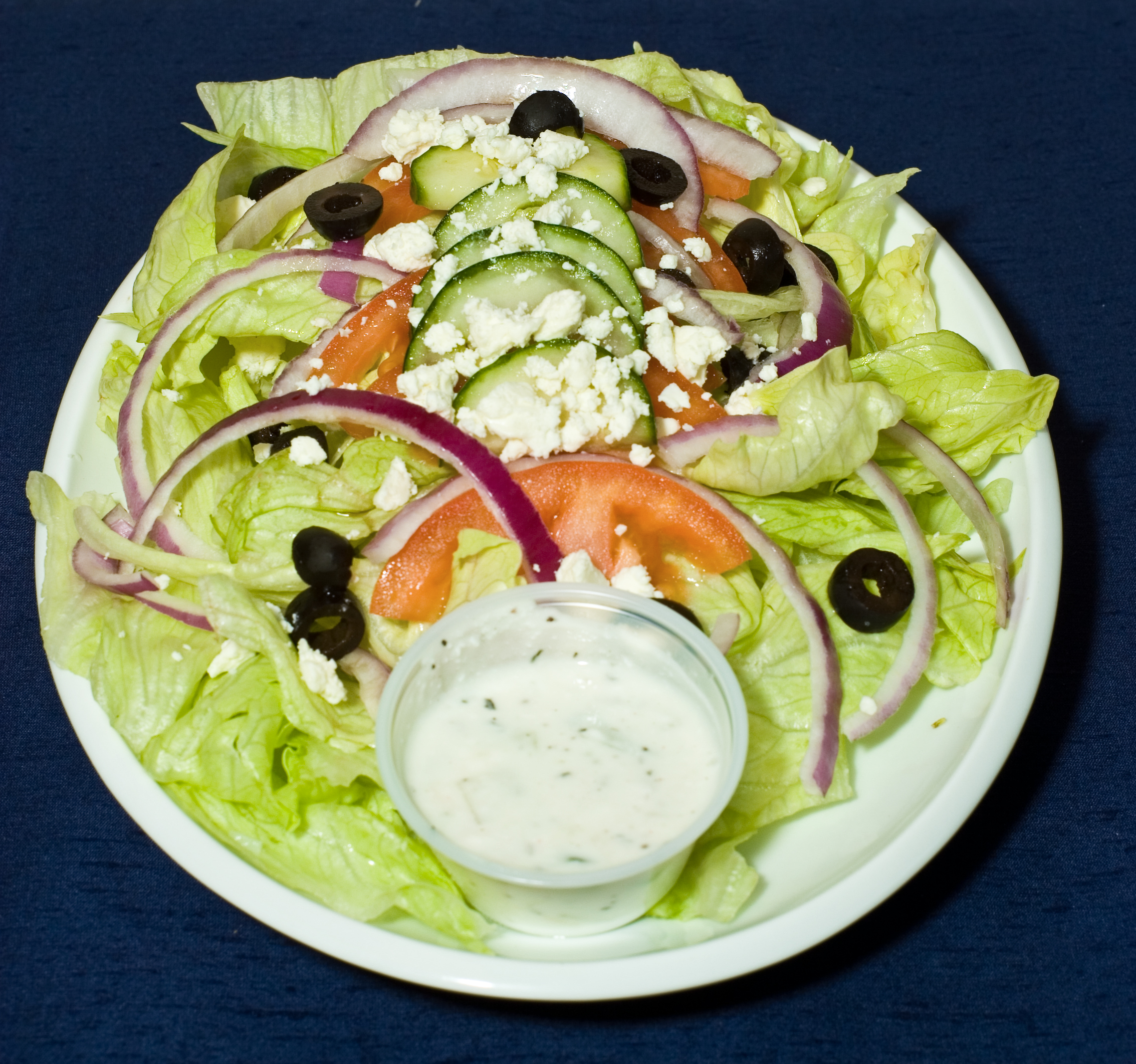 Order Greek Salad food online from Kabobi store, Raleigh on bringmethat.com