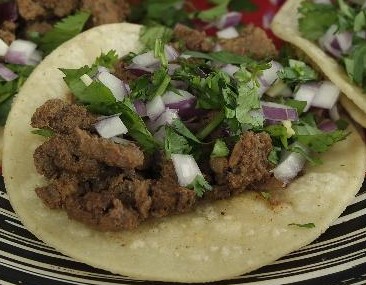 Order 1 Carne Asada Soft Taco, Cilantro, Red Onion, Salsa Chunky food online from Tacos And Wings store, Sunland on bringmethat.com